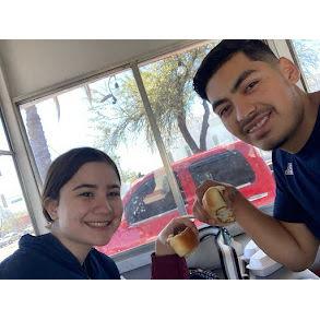 Eating two out of the many, many hot dogs at carreta.