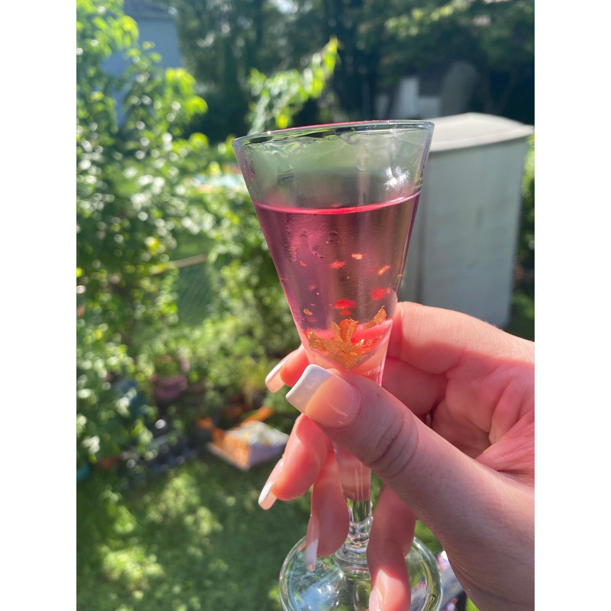 Sharing Julia's homemade cherry gold cordial with their friends Jeremy and Ola to celebrate the day after the engagement.