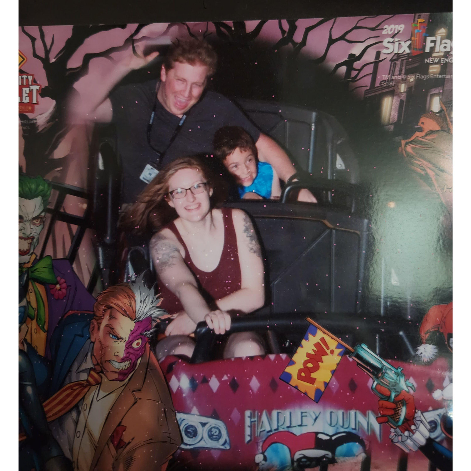 Steven and Korie taking Deyn on a roller coaster at Six Flags