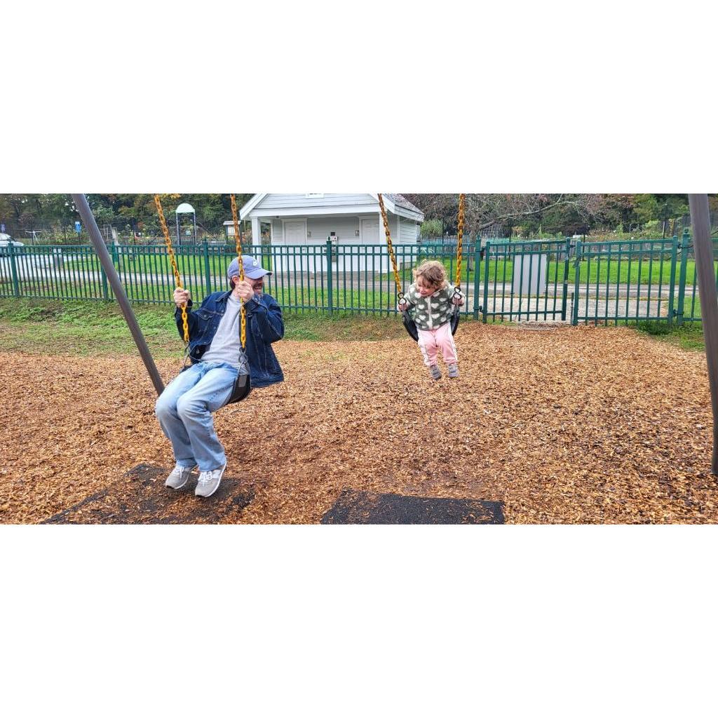 Jay and Eliza on the swings