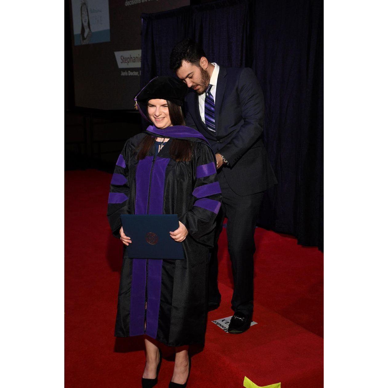 May 2021: Stephanie was hooded by Austin in her Law School Graduation Ceremony.
