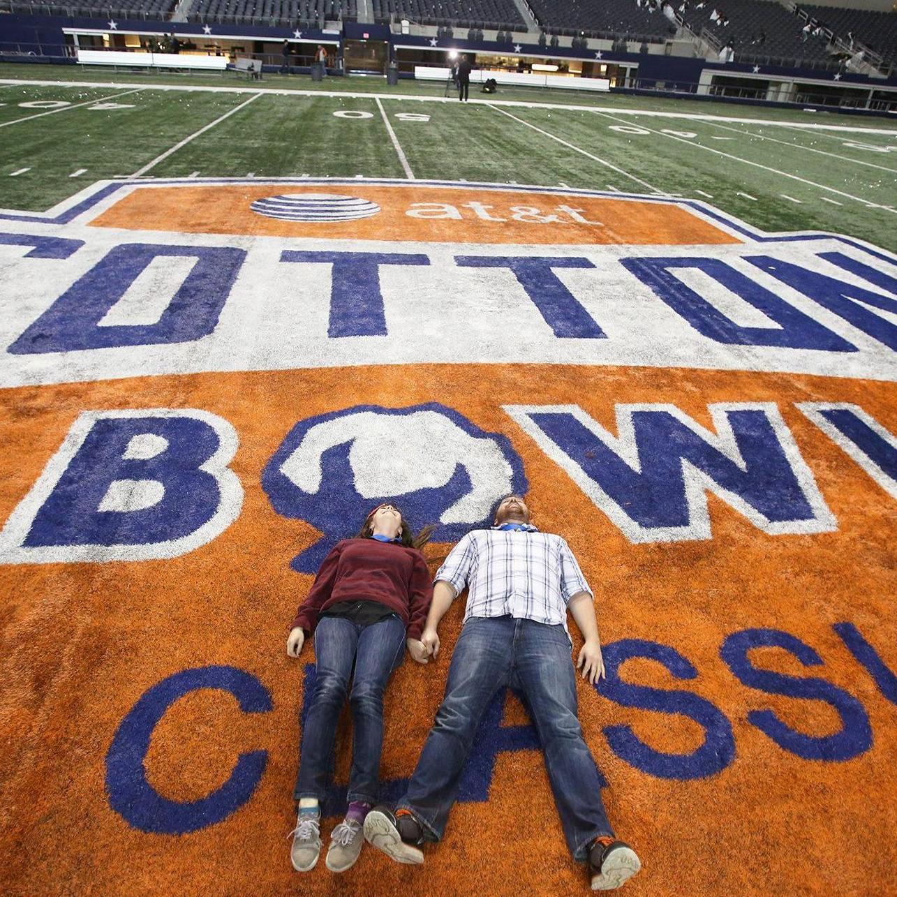 On the 50-yard line after photographing the Cotton Bowl together in Dallas, TX. 2014