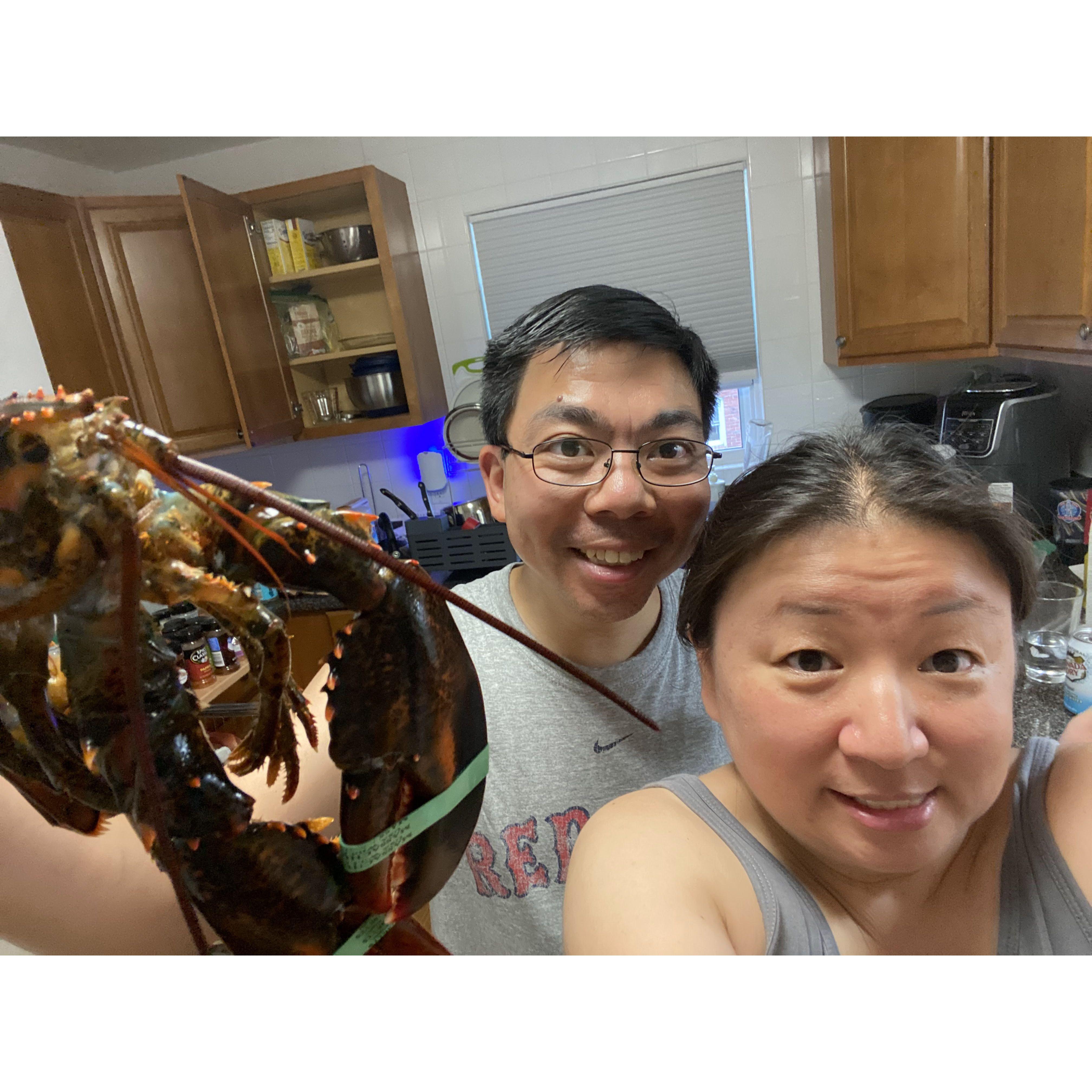 Vicki appears to be terrified with a lobster near her face
