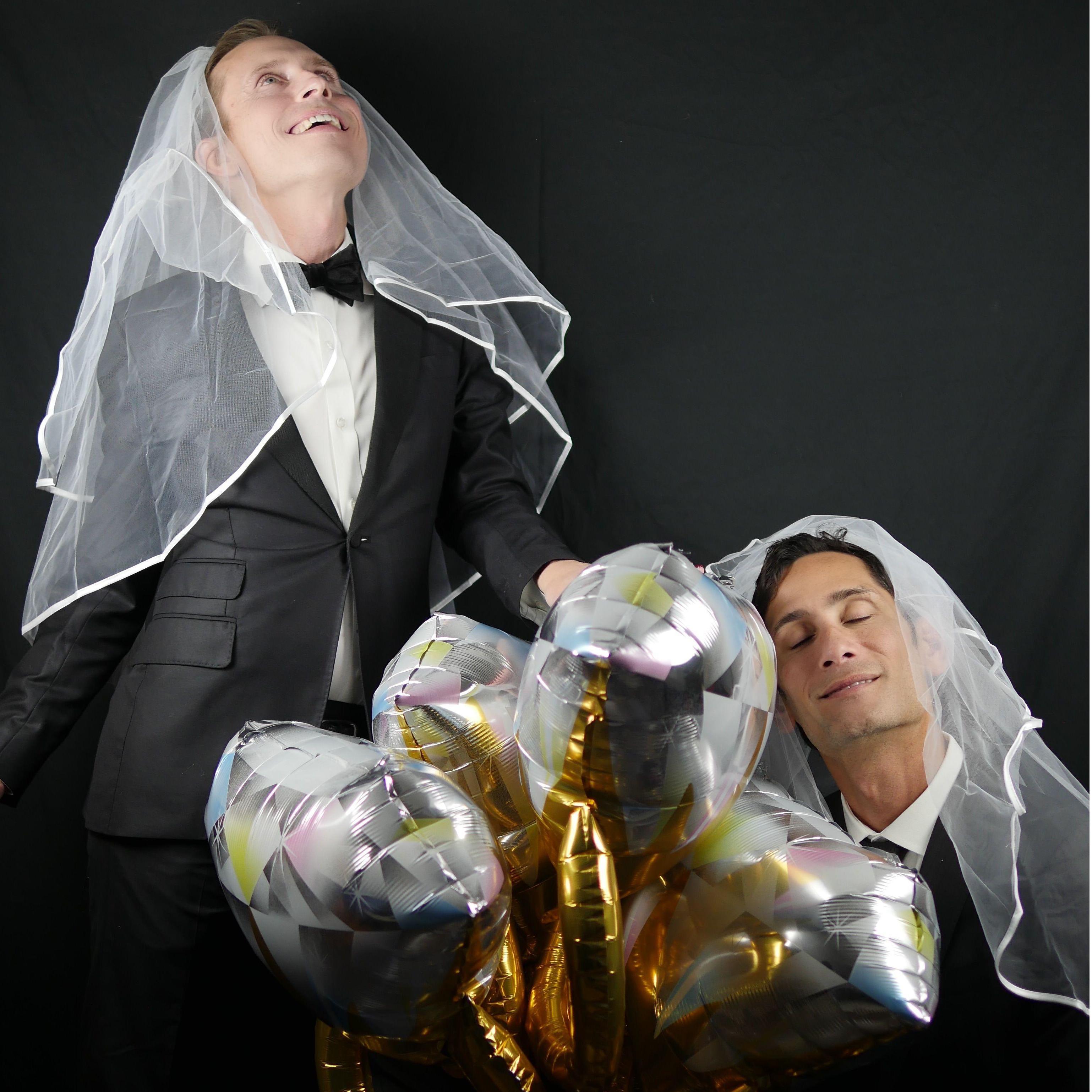 Engagement photo. John-Paul on his knee with ring balloons