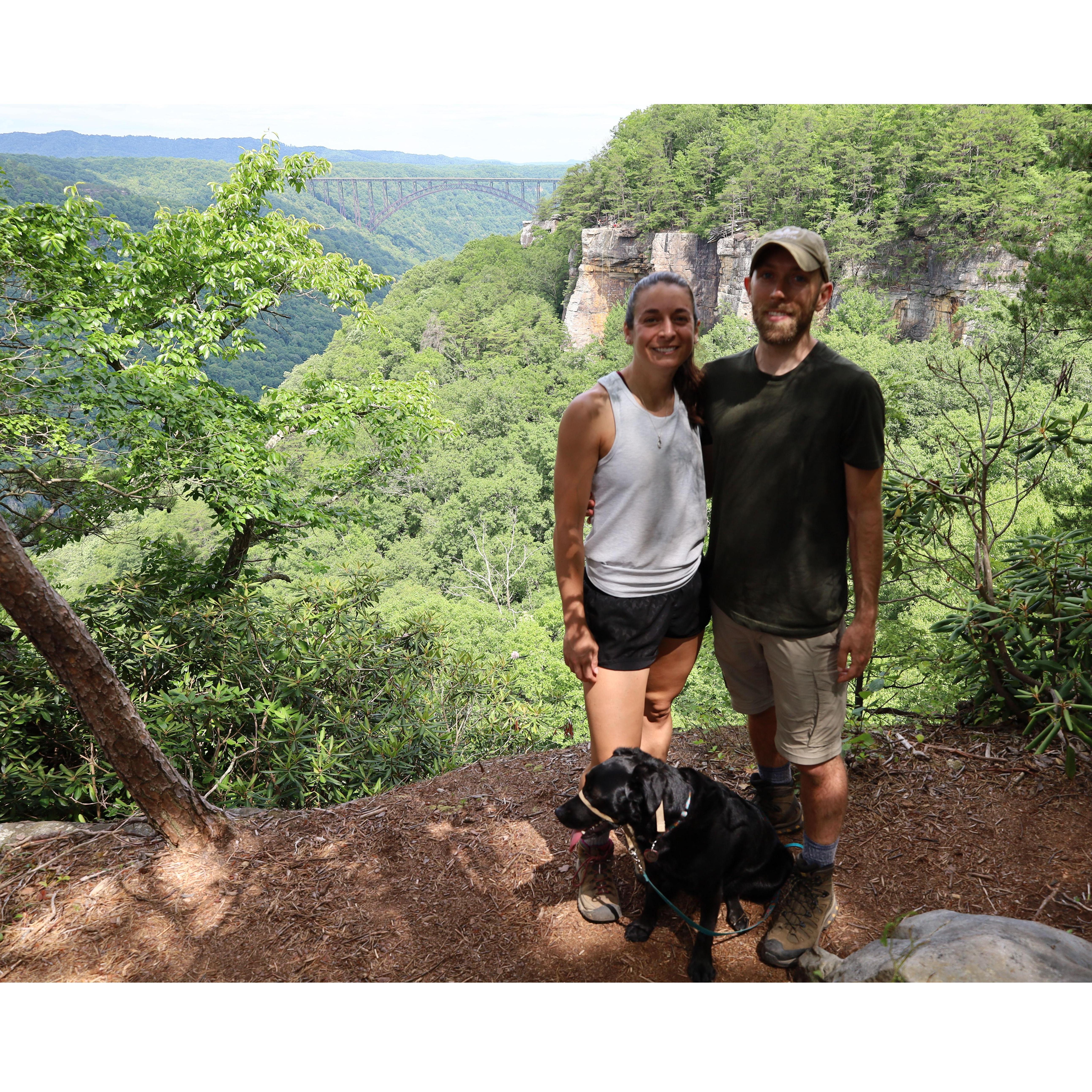 The whole family hiking the Endless Wall trail in New River Gorge National Park.