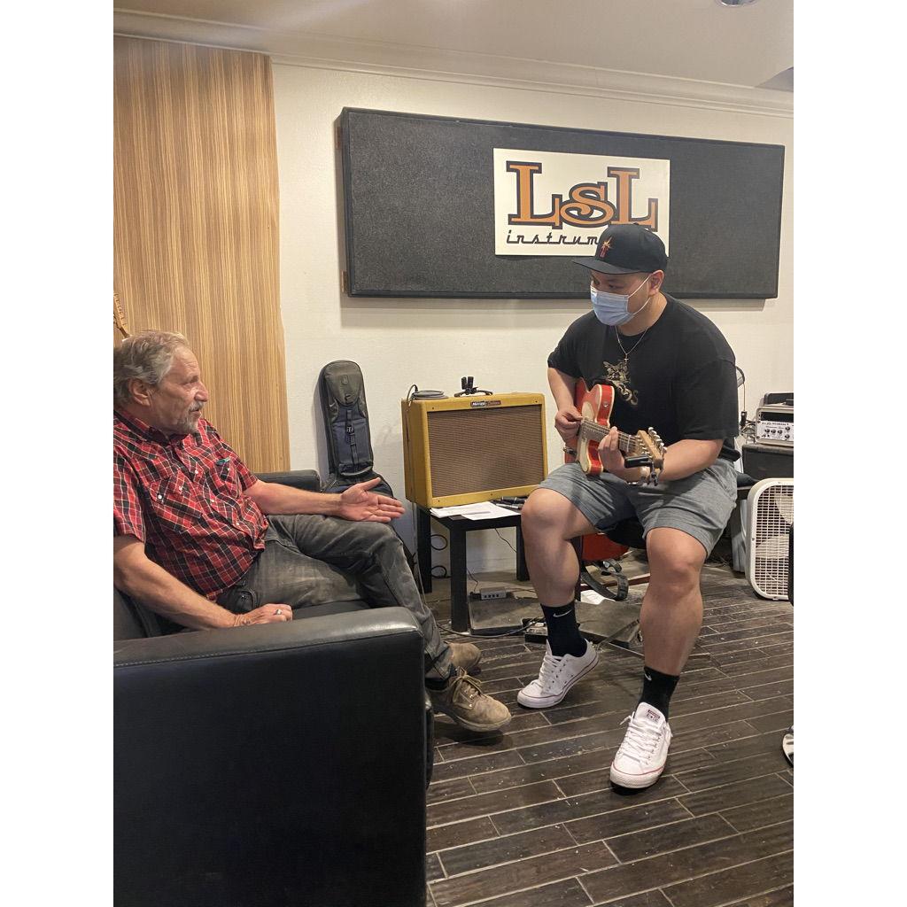 Jesse snagged this pic of me becoming an official artist for LSL instruments!