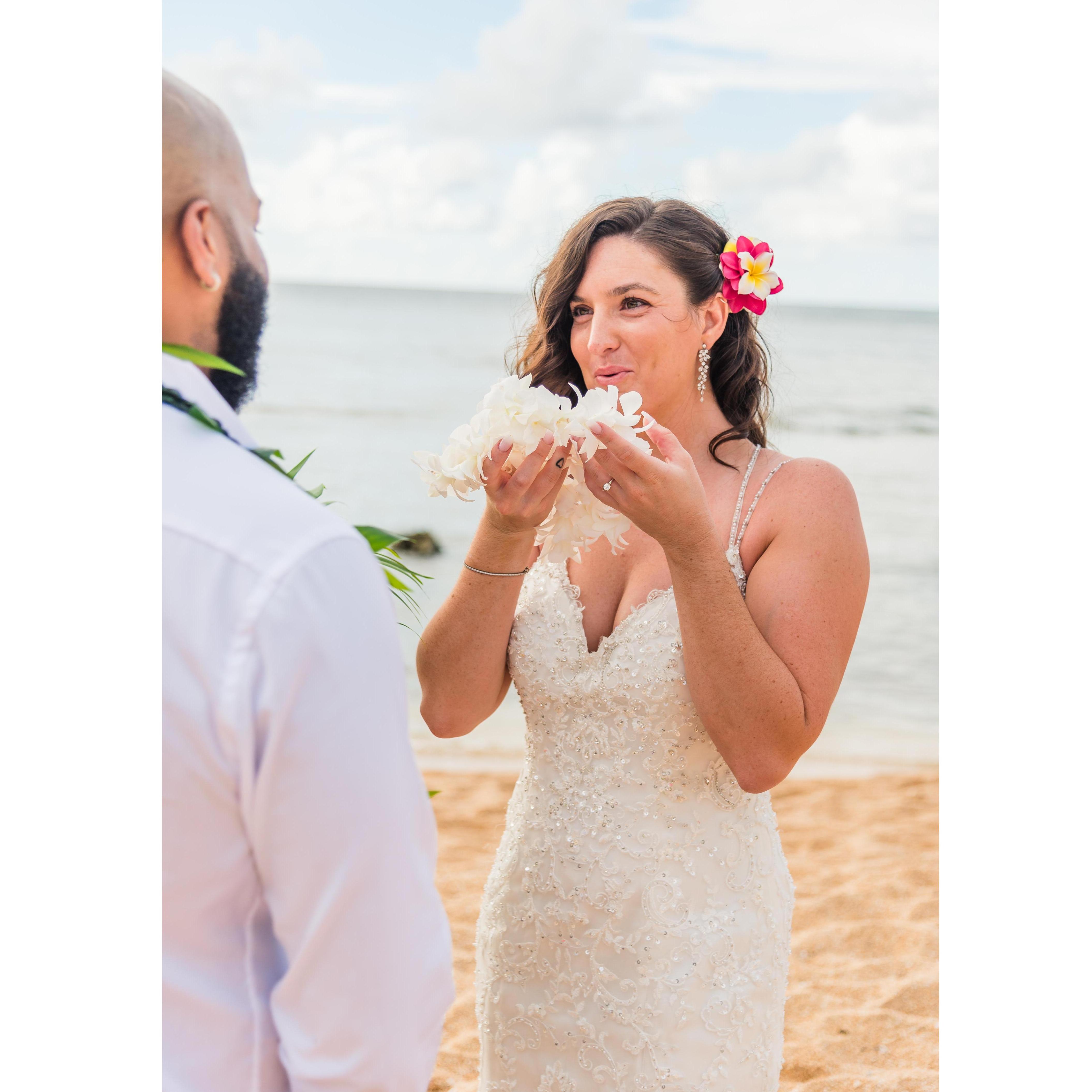 Kayla takes a fresh flower lei and breathes her ‘Ha’ or Life-force into the lei.