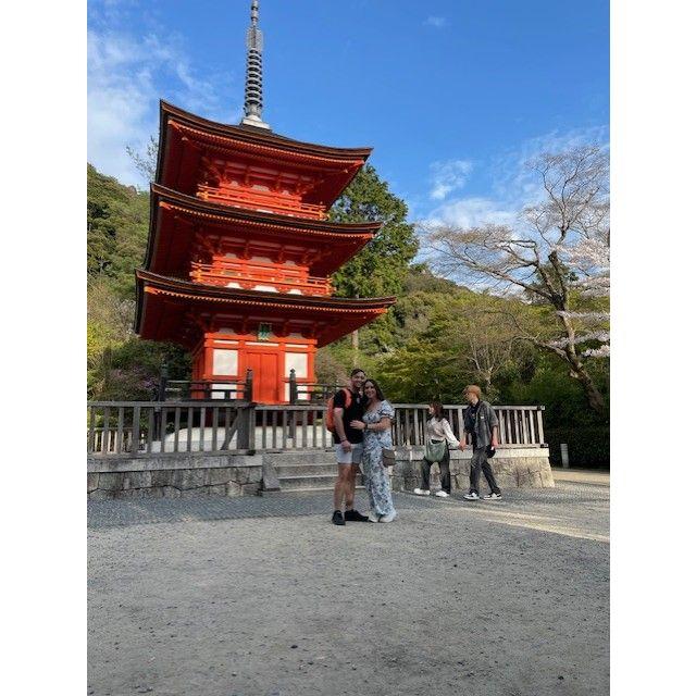 Us in front of the child bearing shrine for good luck.