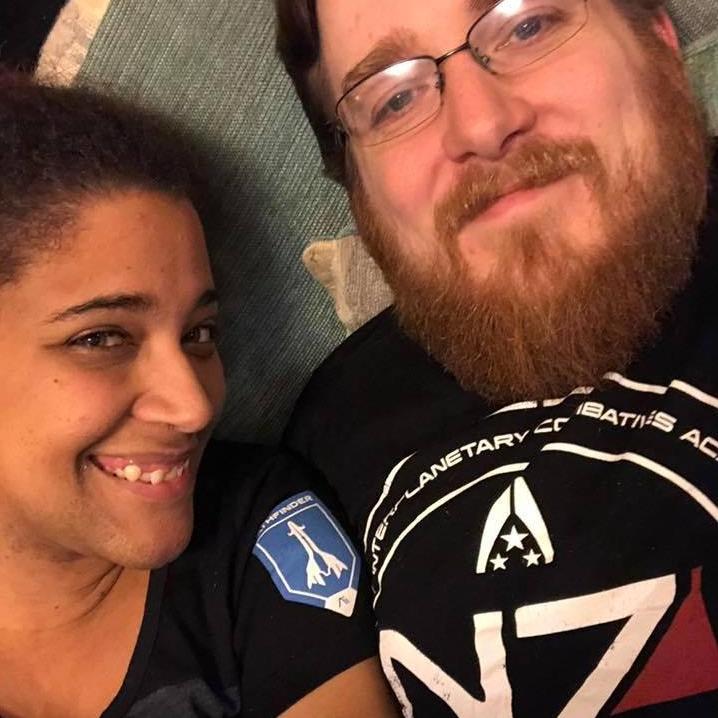 Liz and Keven are large Mass Effect fans. Here they are dressed up for N7 Day.