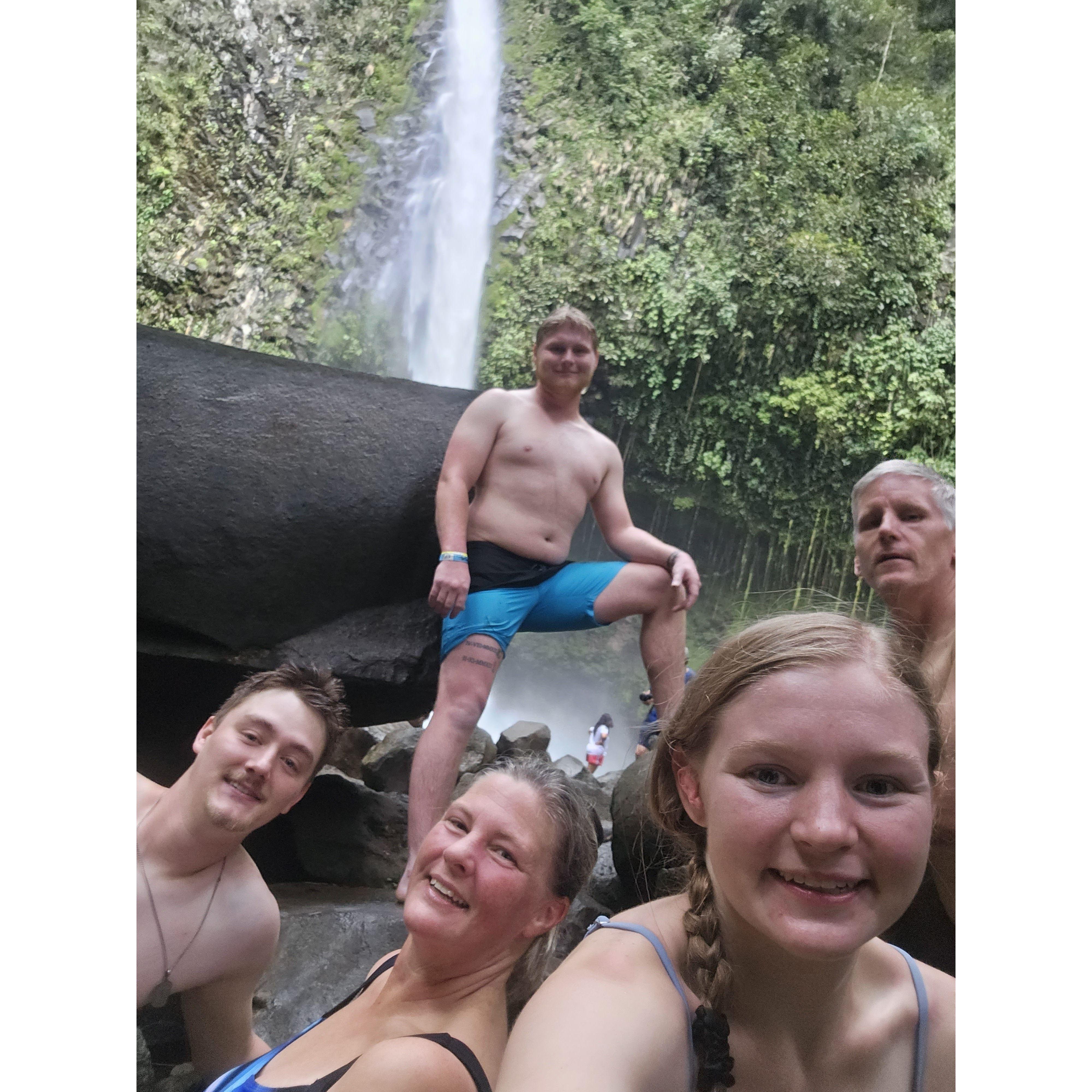 Taylor's family down at the base of La Fortuna falls in Costa Rica.