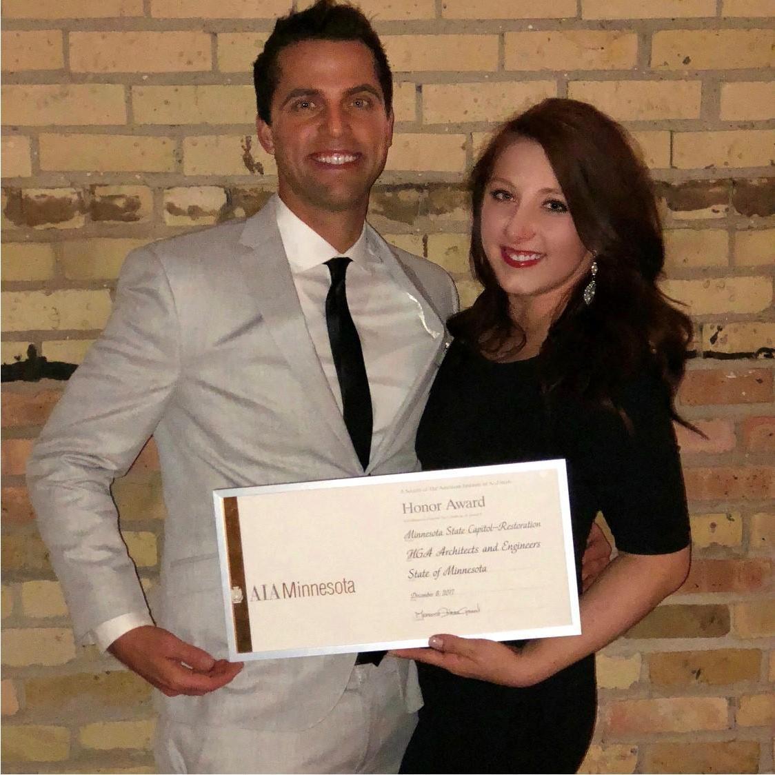 Angela winning awards and Dan pretending he had something to do with it.
