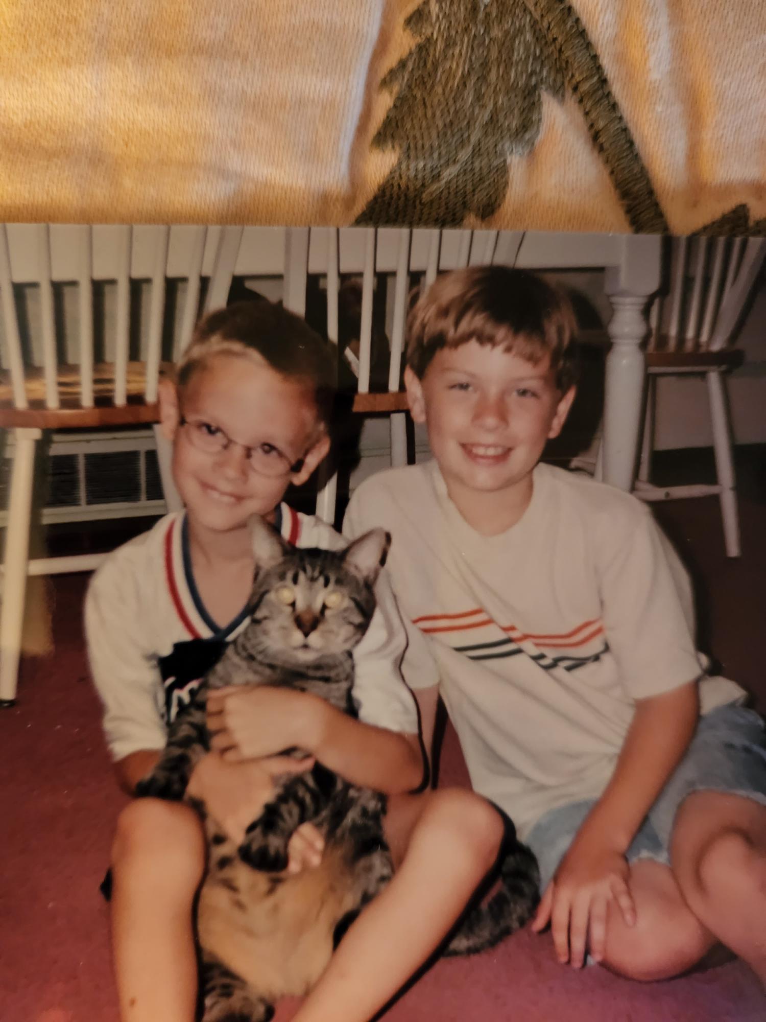 Josiah and Michael enjoying the kittie!