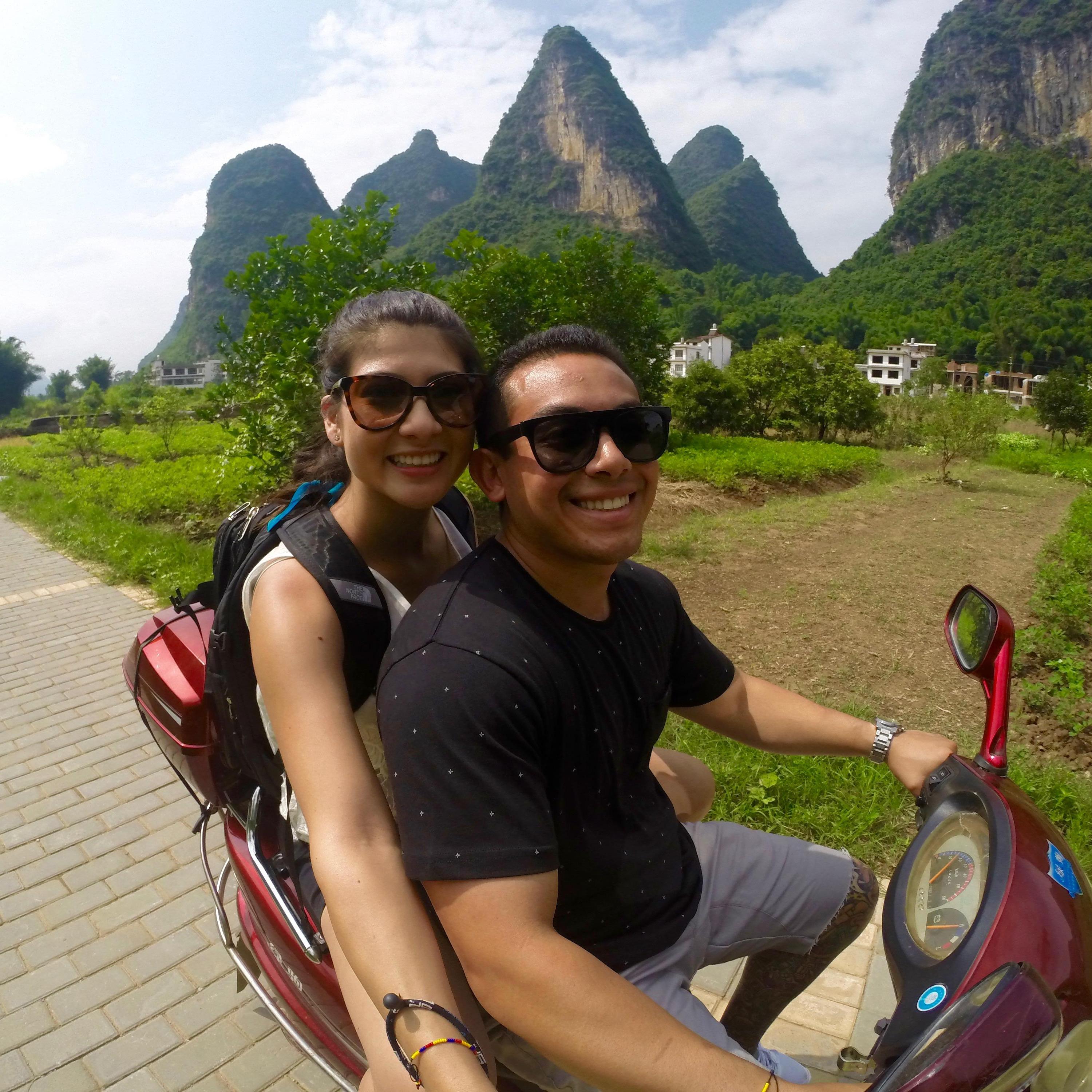Riding scooters through the mountains of Guilin, China.