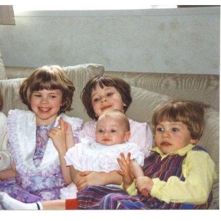 Anne between her sister Cat and brother Francis