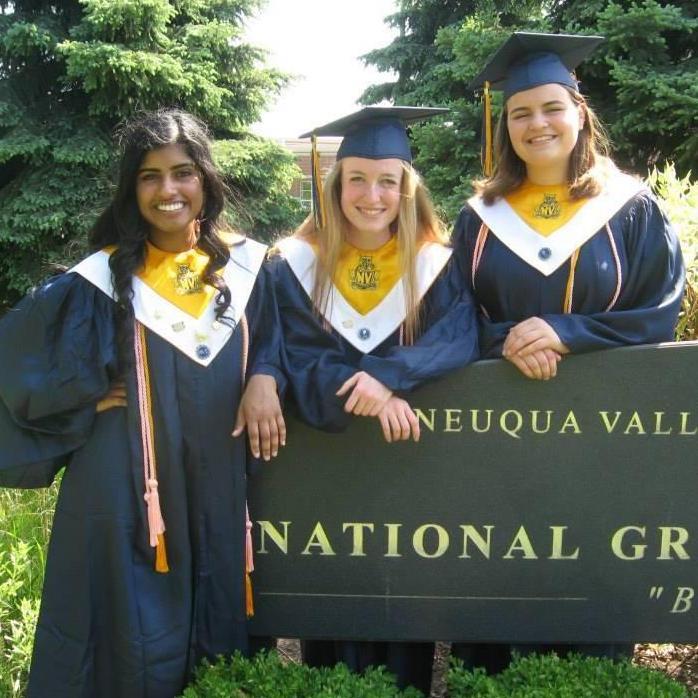 Rhea, Claire, and Evie at their high school graduation