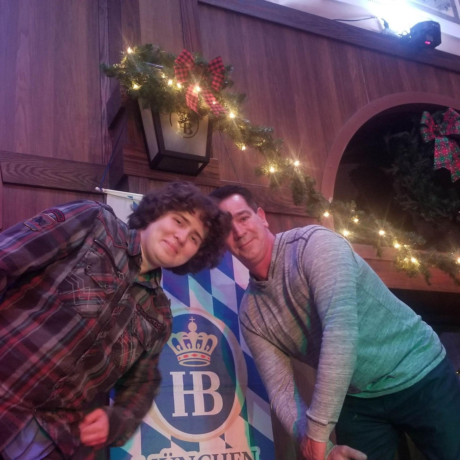 Sam and Connor dancing on a table at Hoffbrauhaus