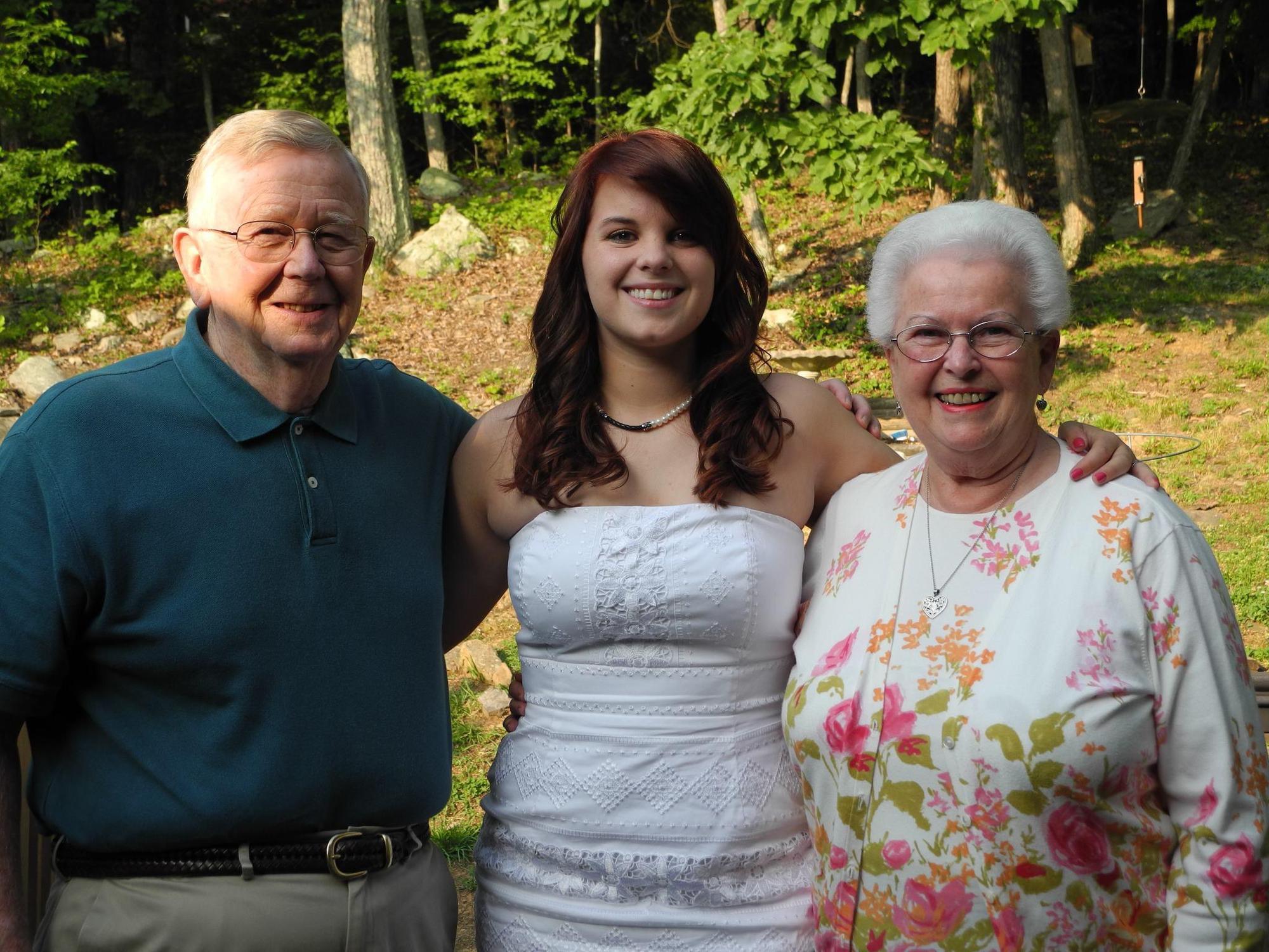 Nikki with Grandma and Grandpa DeVoll at High School graduation, 2012.