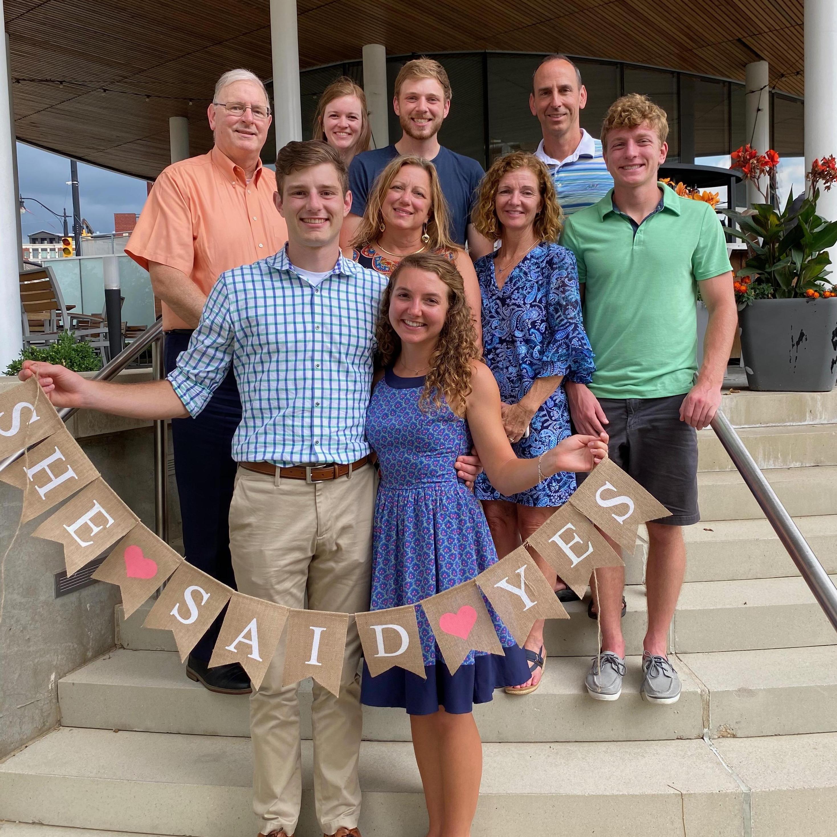 Mattie and Justin's families celebrated with champagne, lunch, and bundt cakes at a nice outdoor restaurant downtown Columbus!