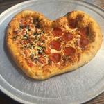 Eat pizza at Claude’s Patio