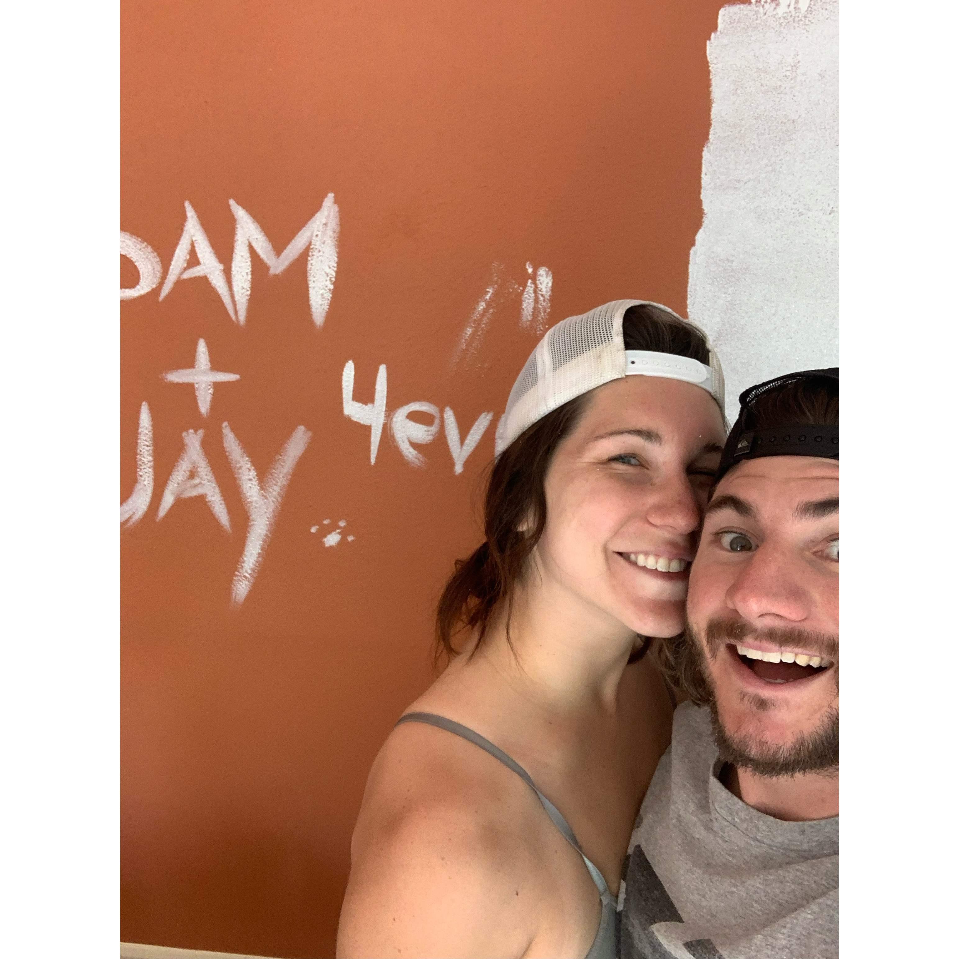 Painting the first of many rooms in our new home! Shosh also signed her name as you can clearly see.