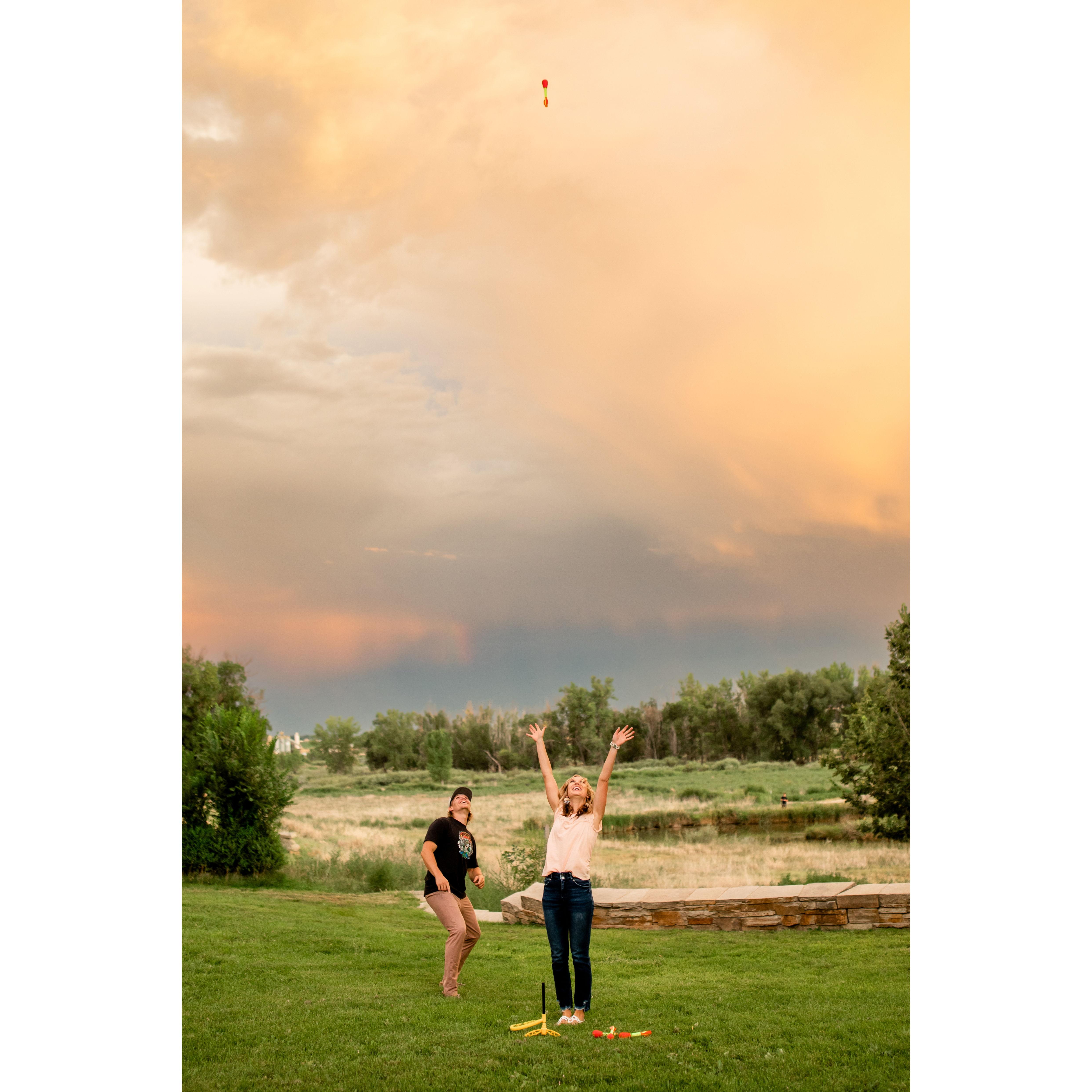 We had some fun during our engagement photos with some rockets - a nod to one of our first dates!