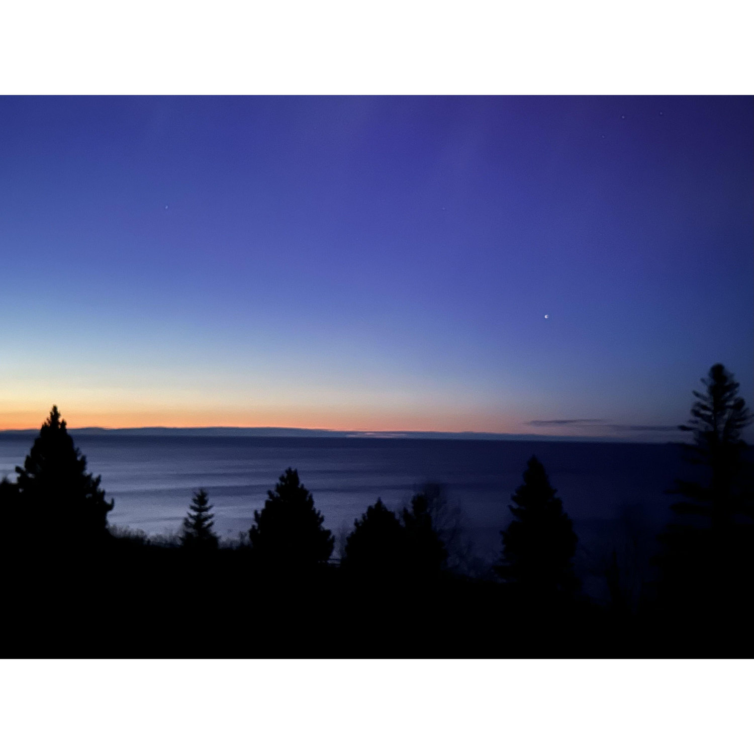 Pre-sunrise on Lake Superior after the northern lights night.