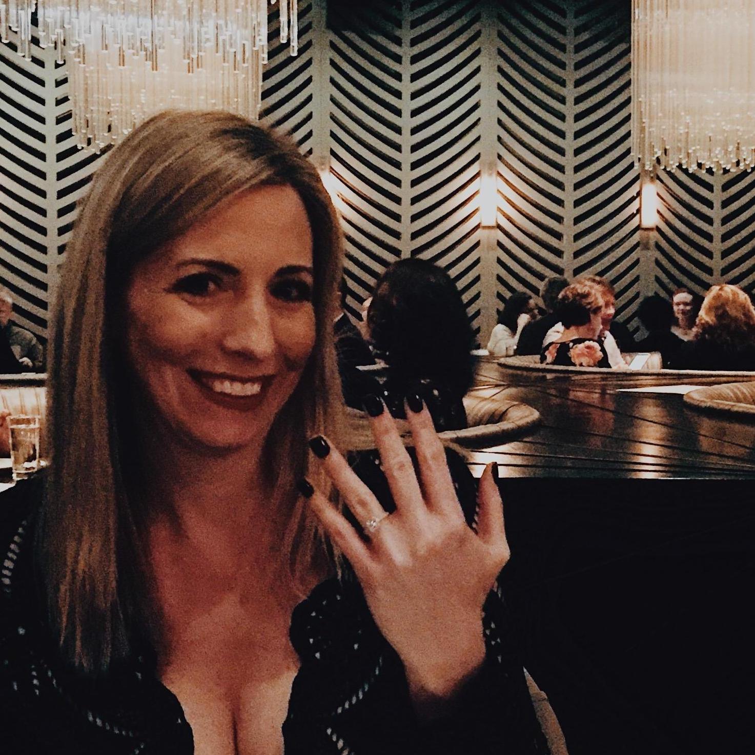 Showing off  the ring...the night Aaron asked Jackie to marry him.