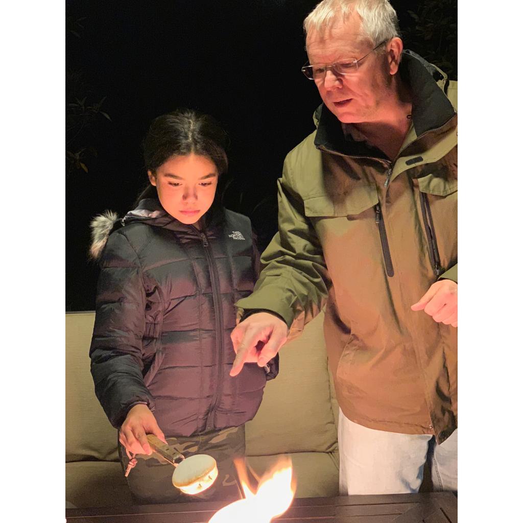 Bella learning to roast marshmallows