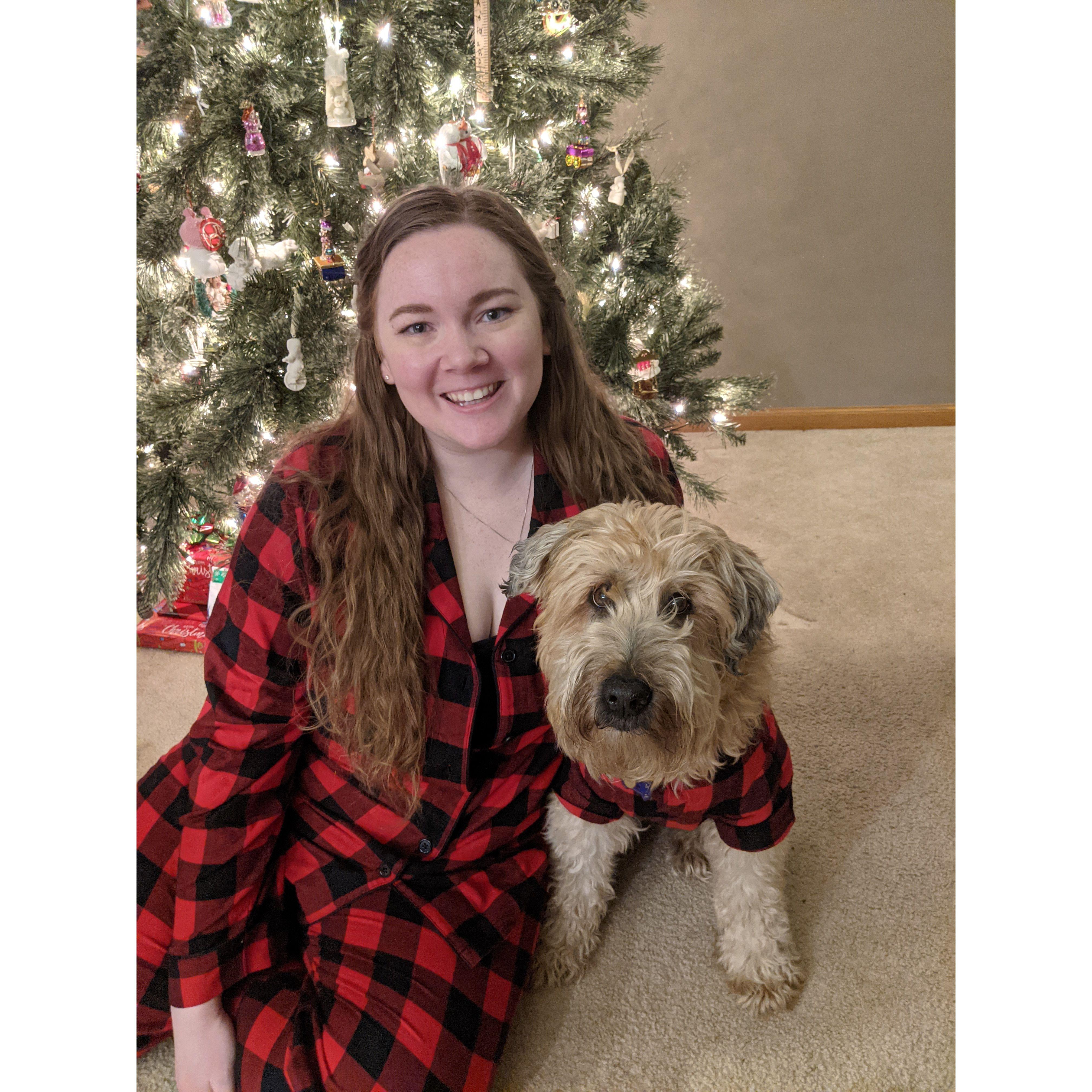 Tori and Olly in matching PJs posing for a Christmas card photo in 2020.