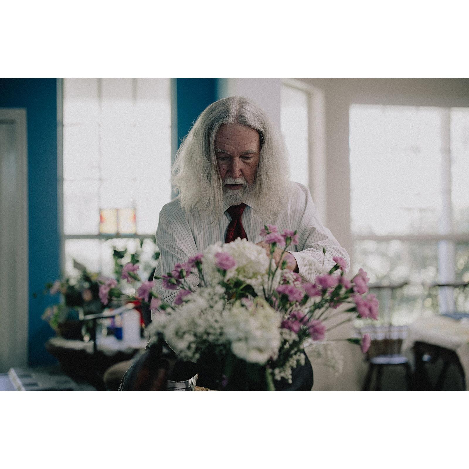 Whitey arranging flowers