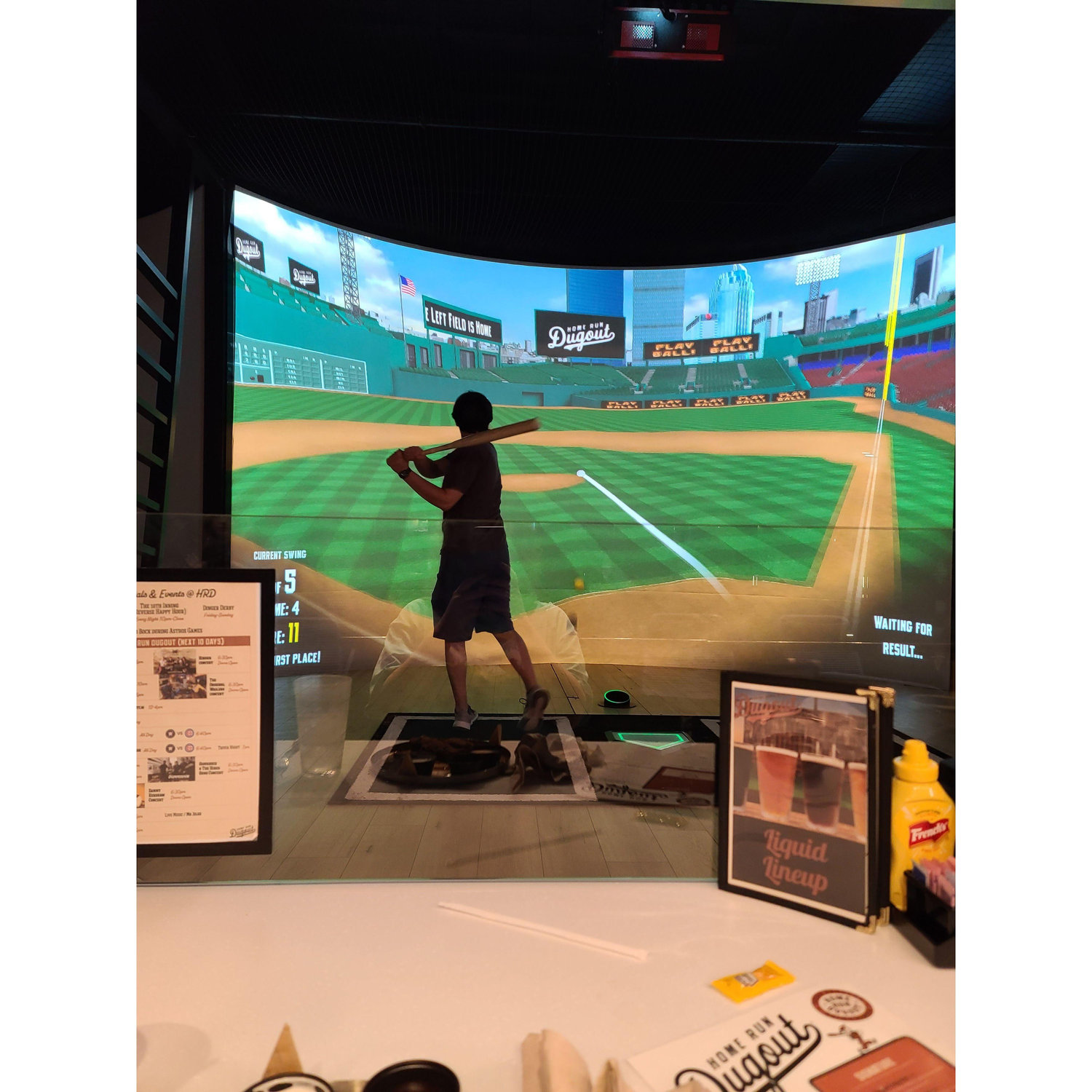 Cameron playing virtual baseball at the Dugout. April 2024
