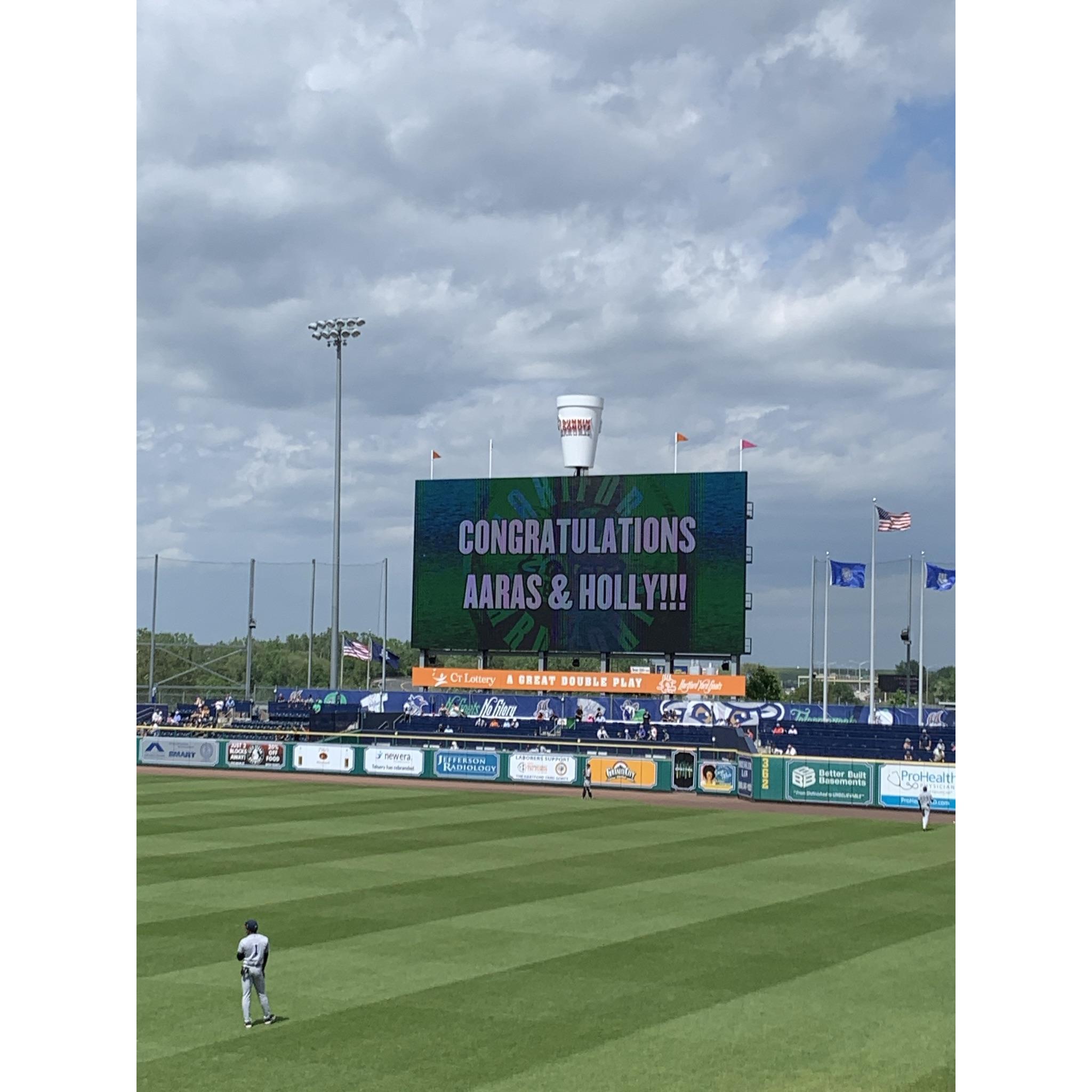 Celebrating our engagement at our one of our favorite local places - Dunkin' Donuts Park home of the Hartford Yardgoats!