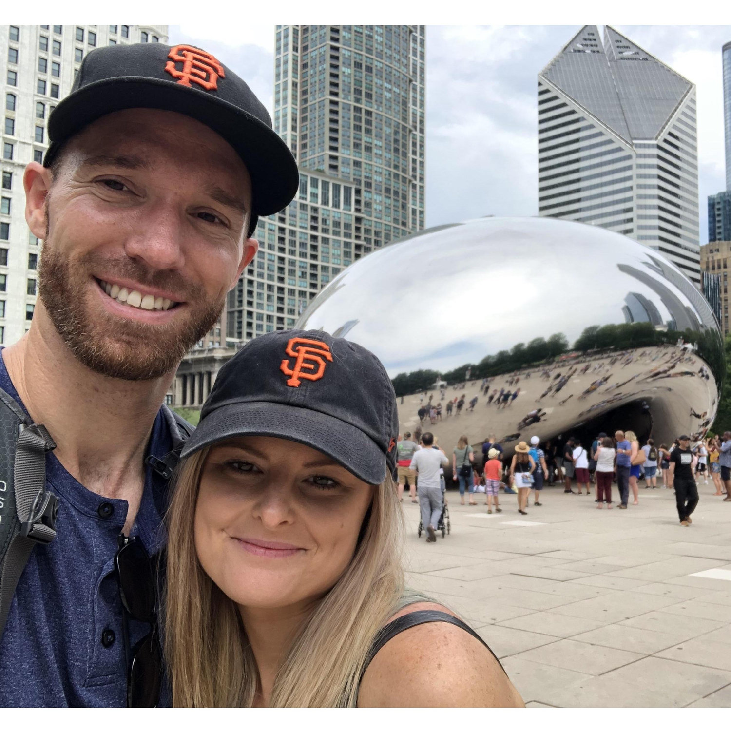 Being tourists in downtown Chicago, IL marveling at The Bean (Cloudgate)