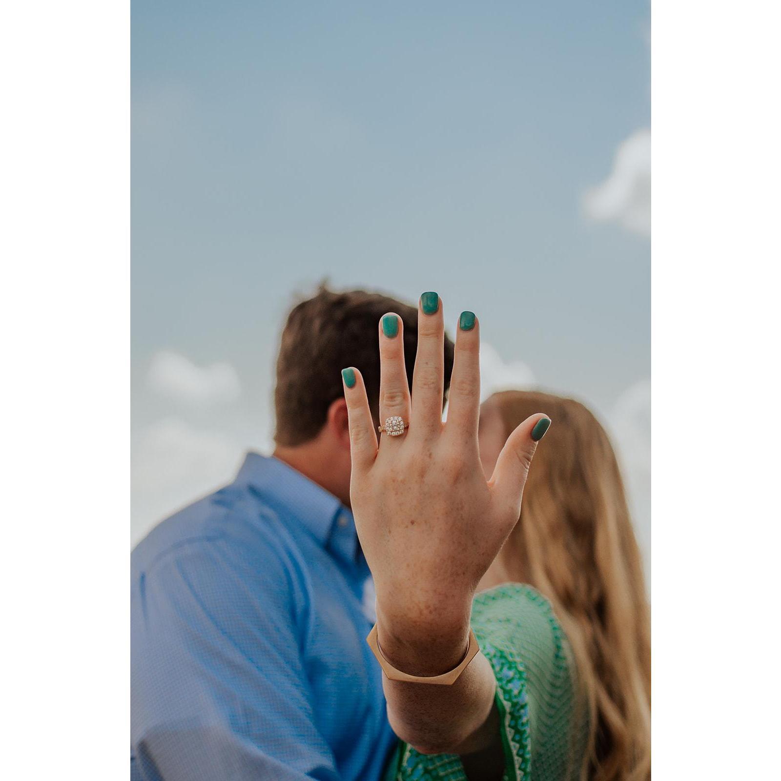 The middle stone within the engagement ring is a gift from our dear Boo Boo, Brett's paternal grandmother who now watches over us from heaven.