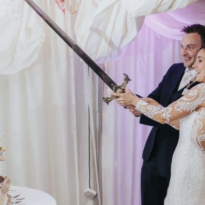 The pagan urge to cut the cake with a sword.