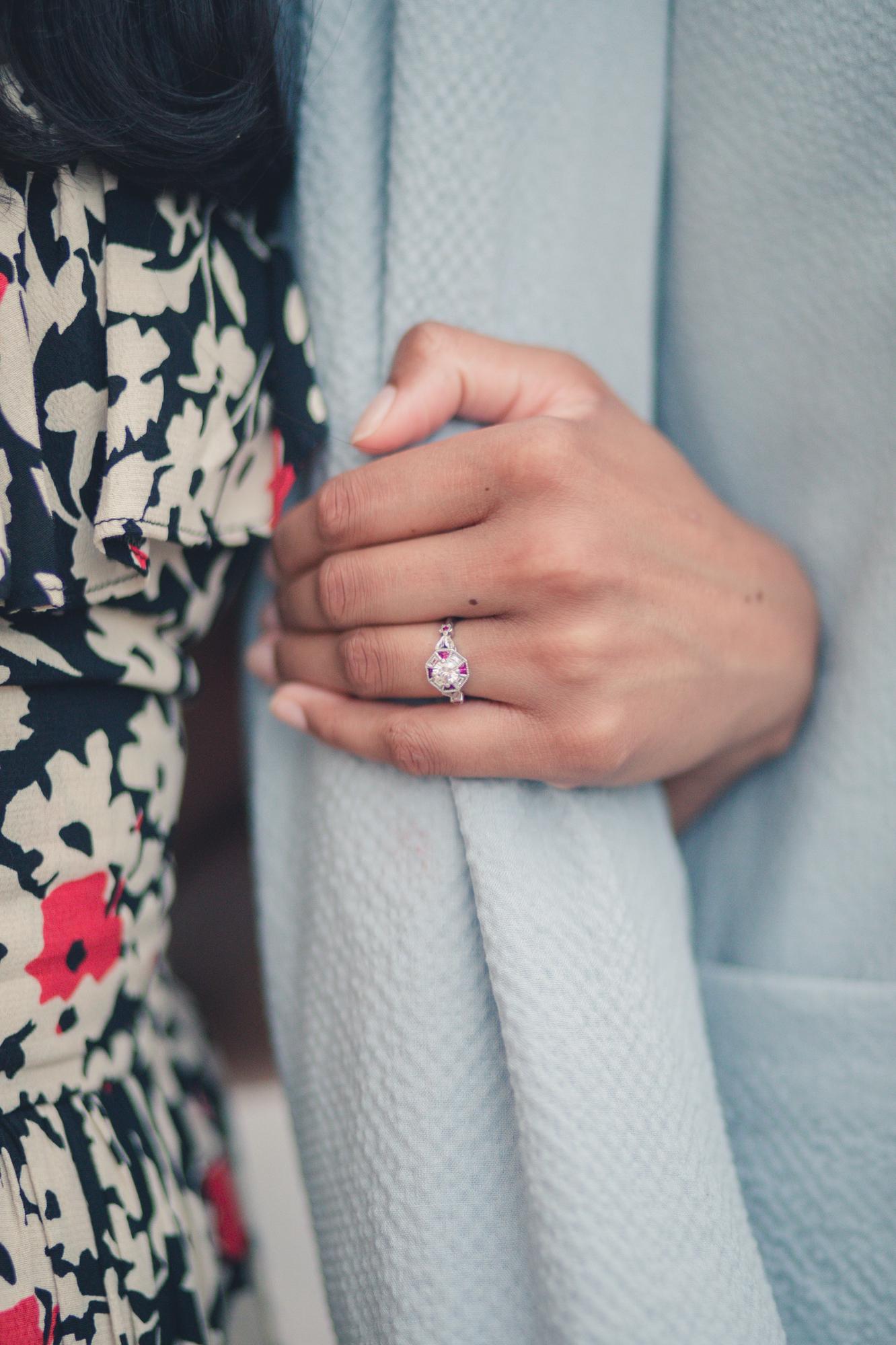 Dan and Chands wanted the ring to symbolize two families & cultures uniting. The center stone is Daniel’s mom’s diamond and the surrounding stones are red rubies to pay tribute to Hindu culture.