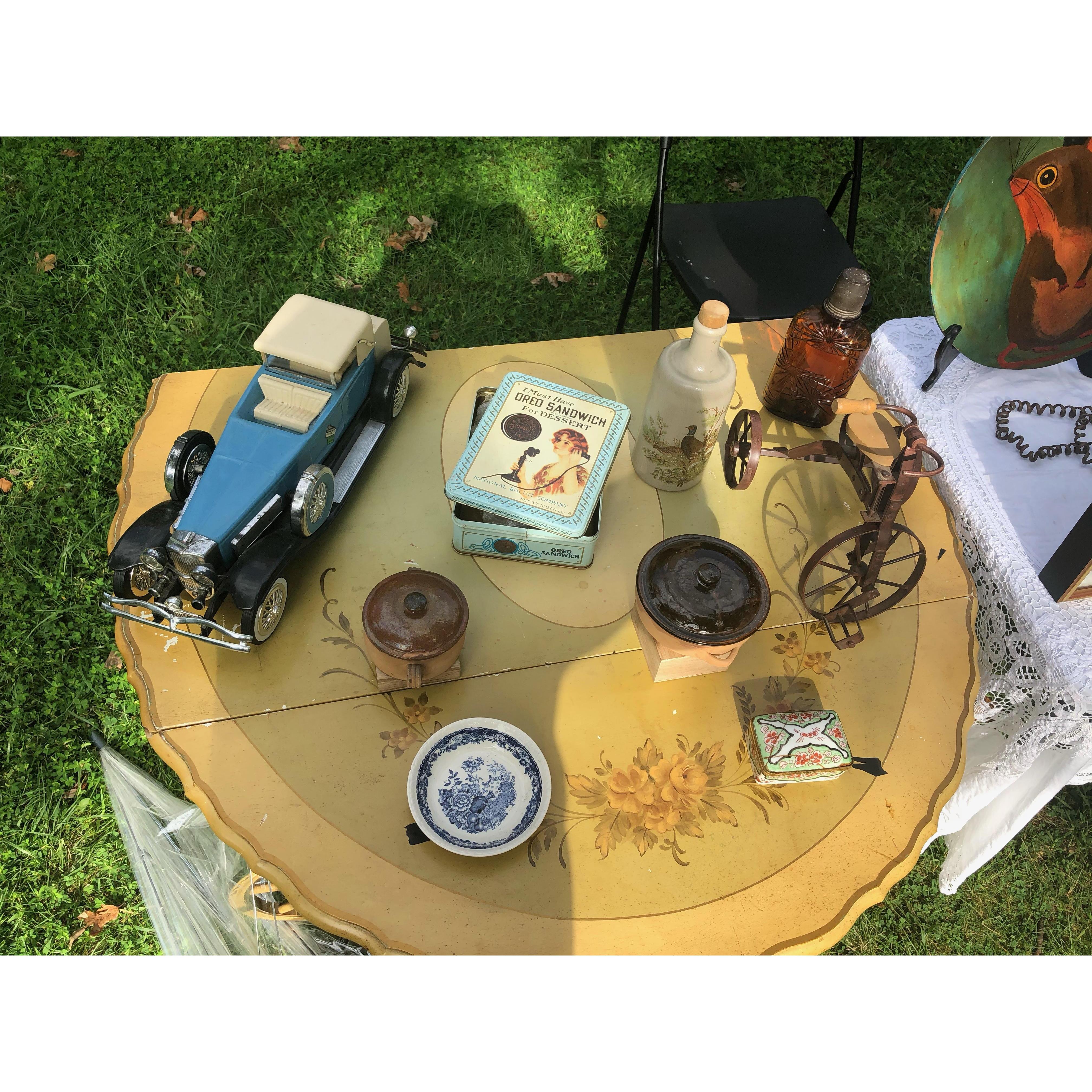 As they looked & discussed the pieces, Peter asks them to watch the stuff while he grabs additional inventory from the car. As he steps away, he mentions that everything was for sale - even the table