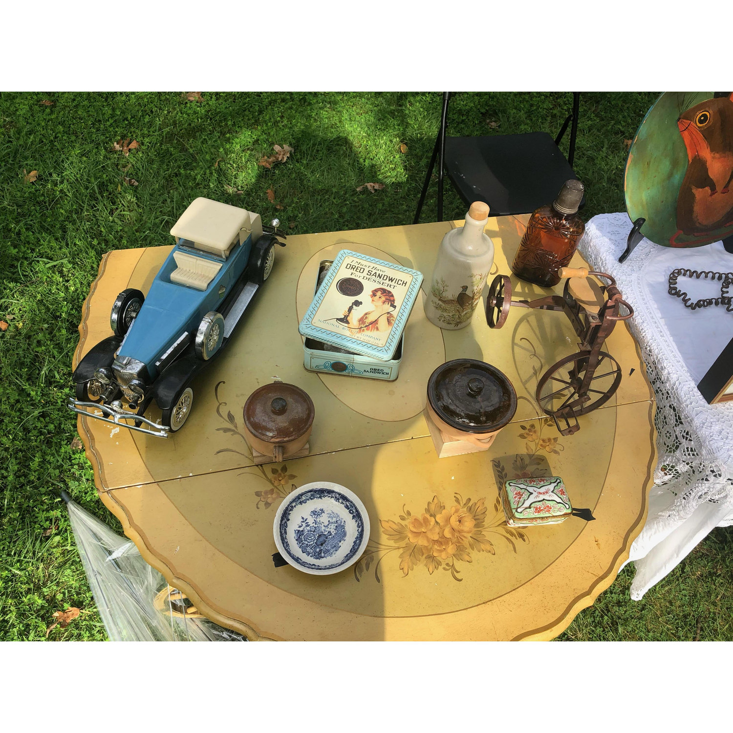 As they looked & discussed the pieces, Peter asks them to watch the stuff while he grabs additional inventory from the car. As he steps away, he mentions that everything was for sale - even the table