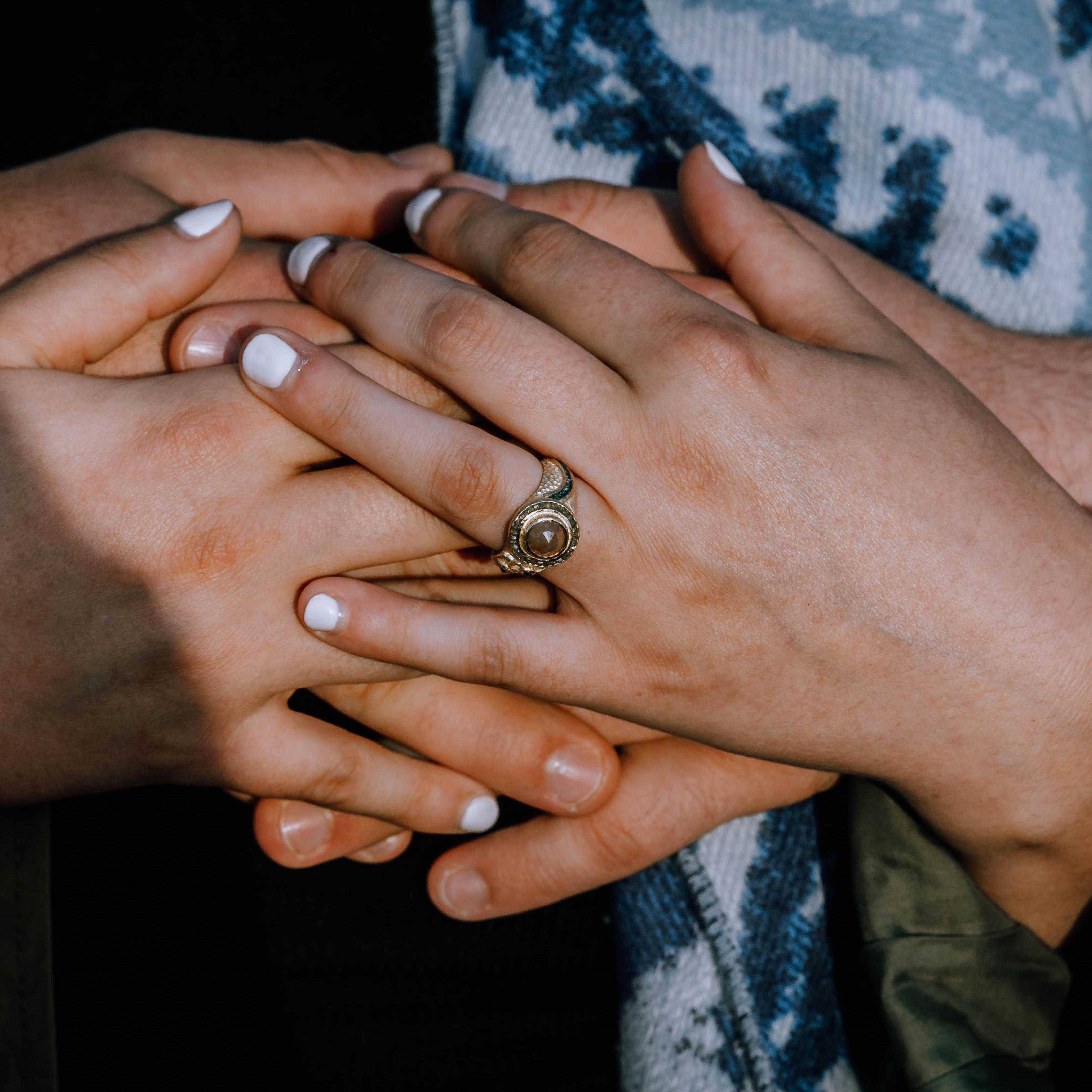 We call this: The Almagation of Fingers, The Finger Puddle, The Hand and Cheese Sandwich. The Hand Horde.
The only appropriate way to show off a new ring. She's a beauty alright!