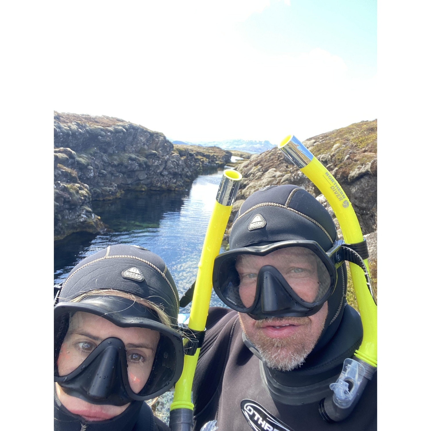 Snorkeling in dry suits in Iceland
