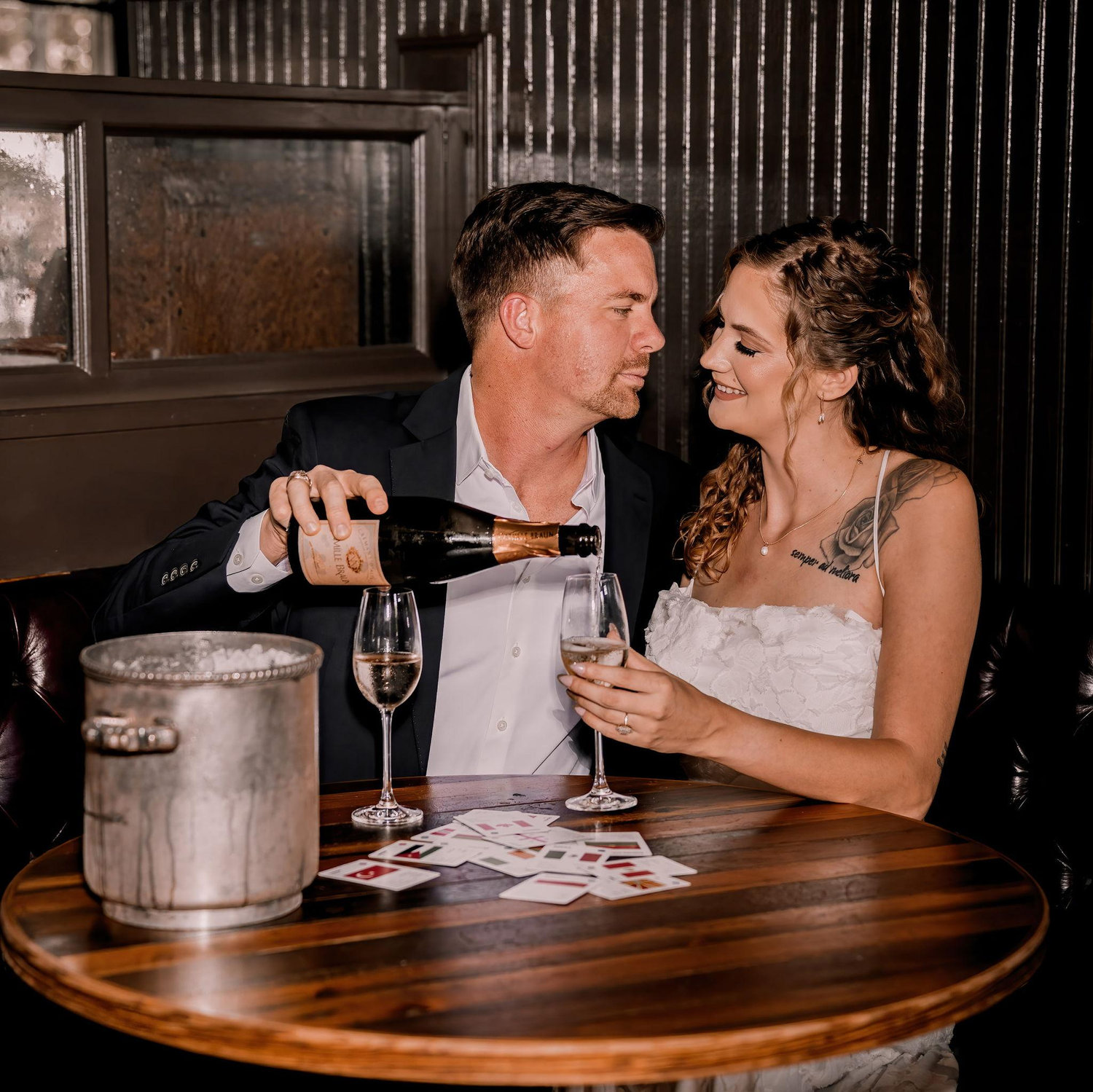 From our engagement shoot, with our favorite card game and a bottle of champagne.