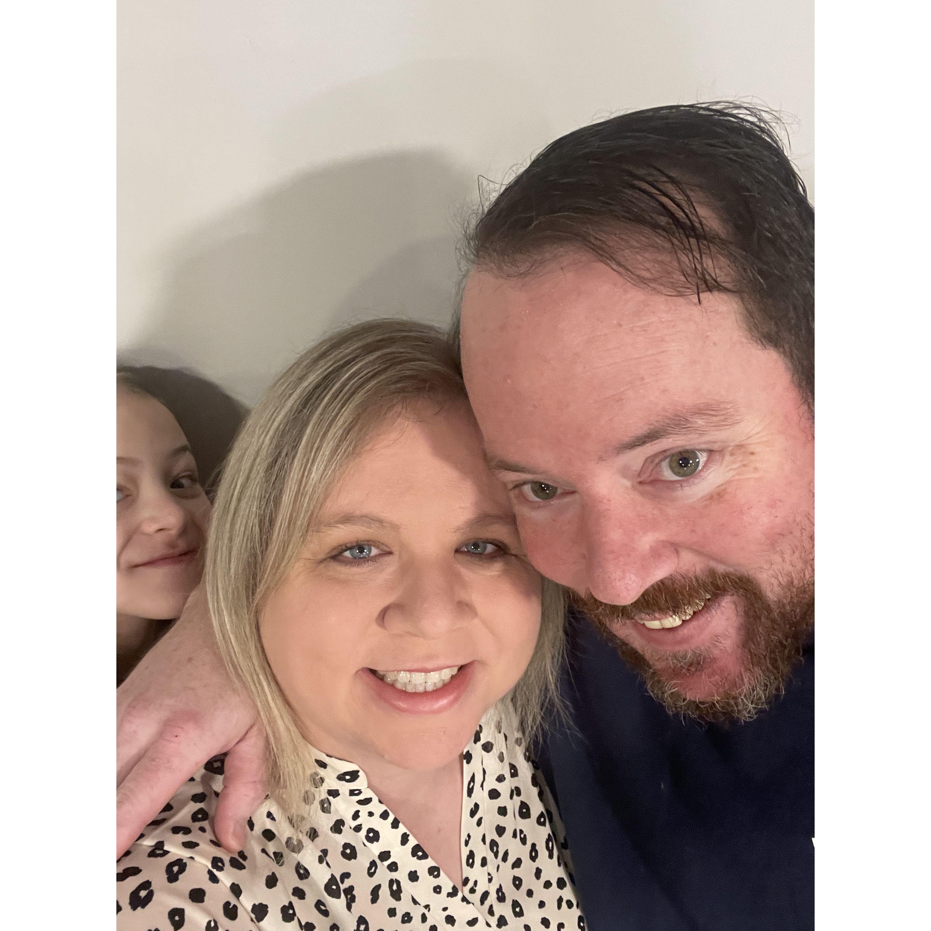 The was taken on our first anniversary, before we went on our date.  Kinsley couldn't resist photo bombing us.