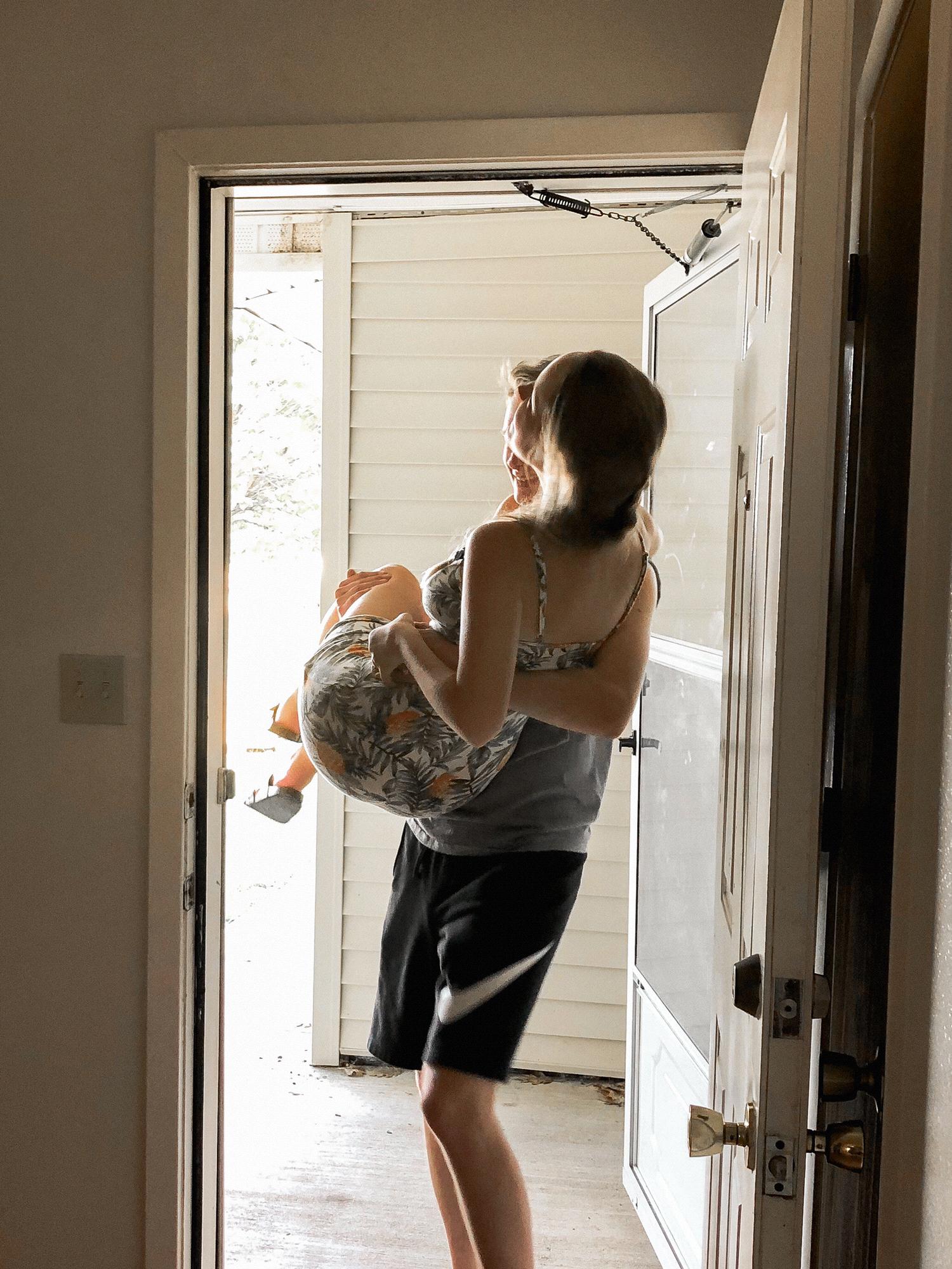 Crossing the threshold of our first home.