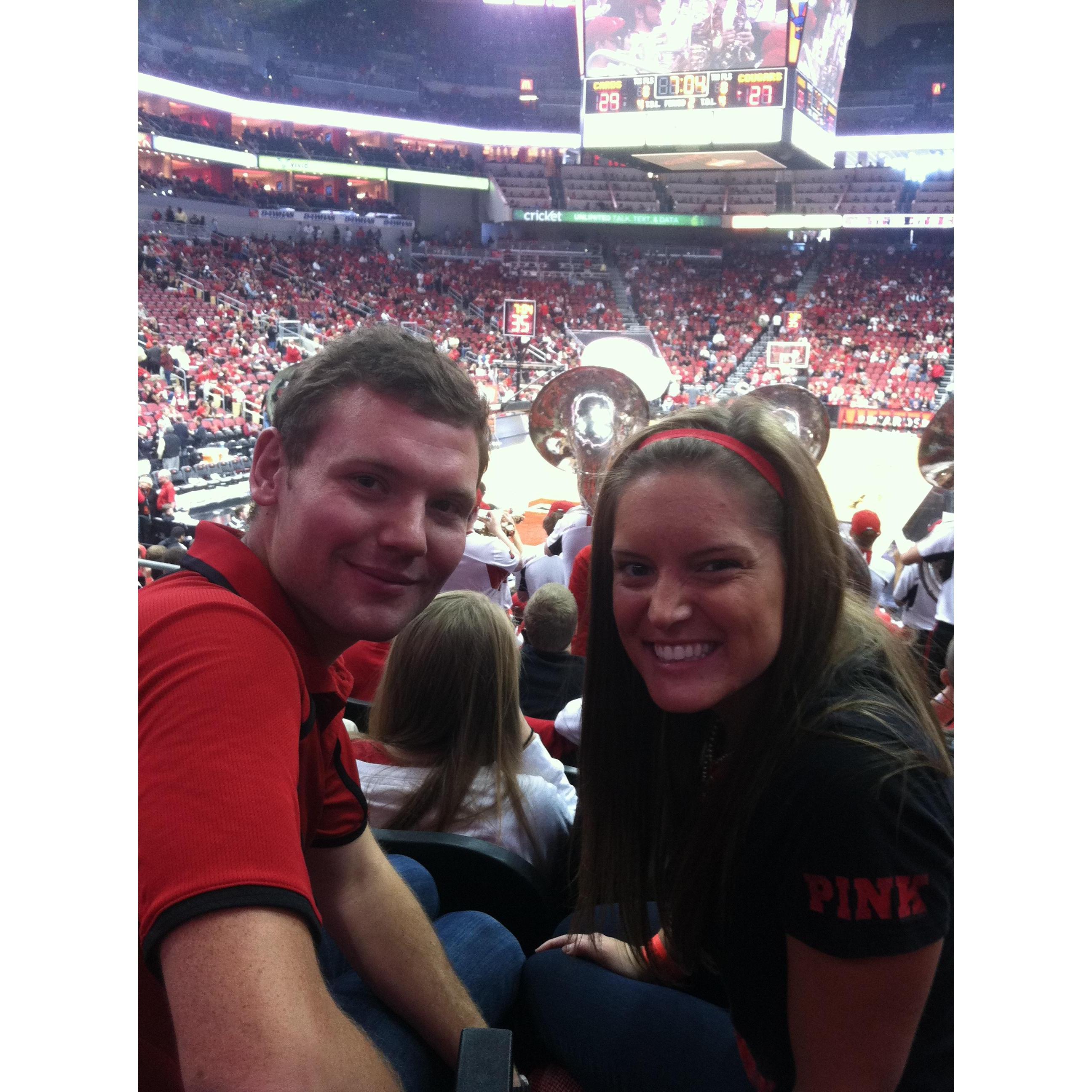 Jeff asked Mimi on a date in 2013 to a basketball game. She was (and still is) unconvinced that this was a date. Fun fact- Jeff got Mimi a matching red polo shirt to wear to future basketball games.