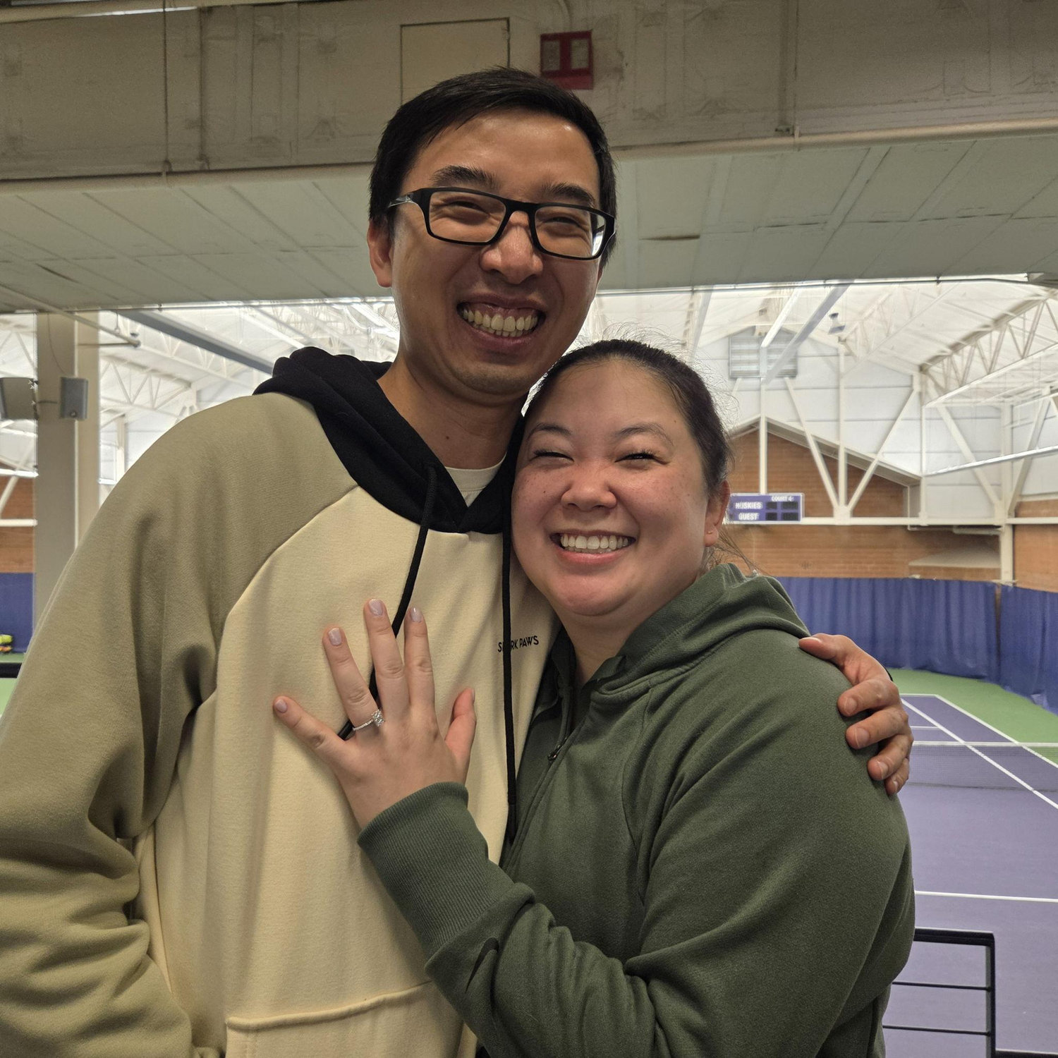 Surprise engagement at Nordstrom Tennis Center.