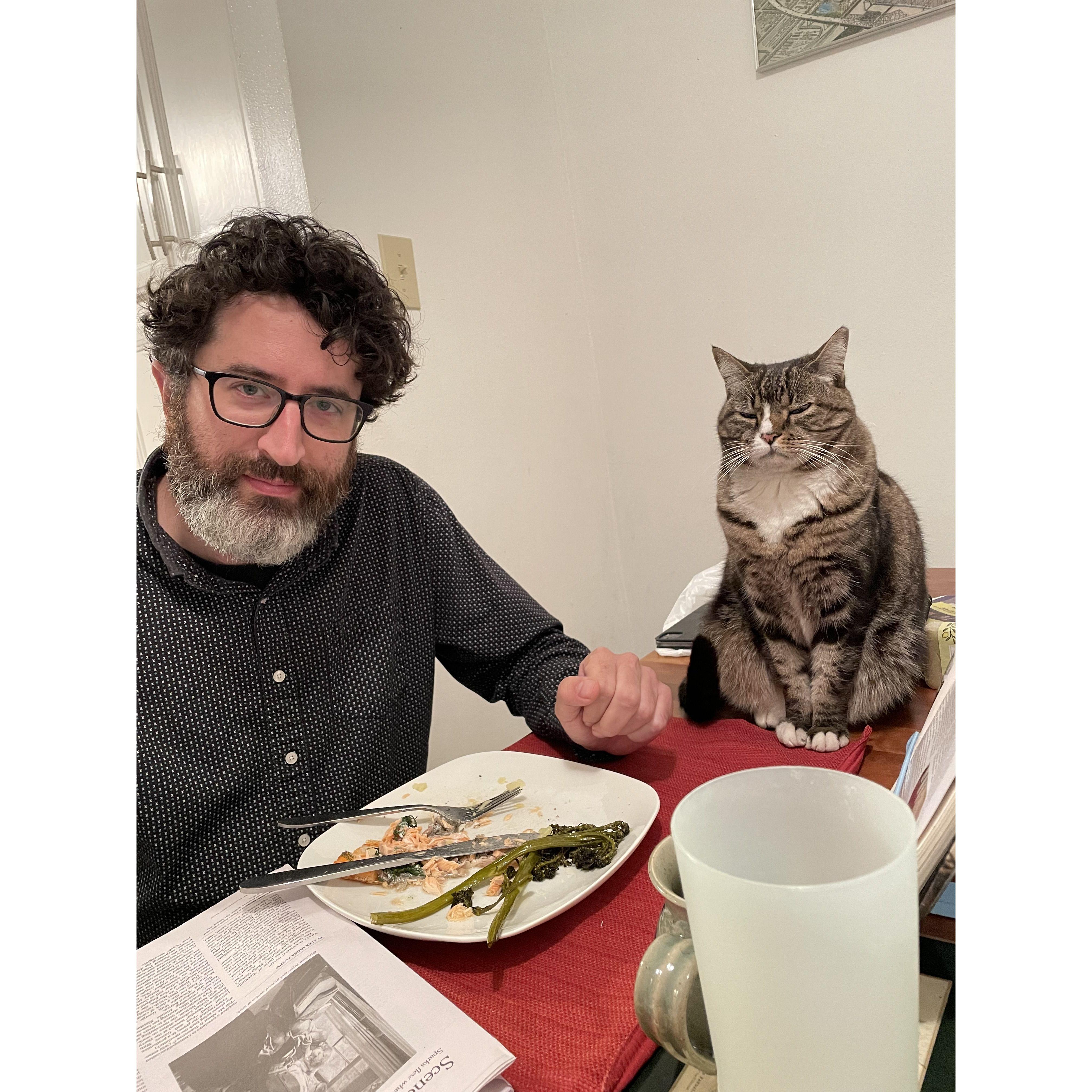 Brian dines with his cat, Katie