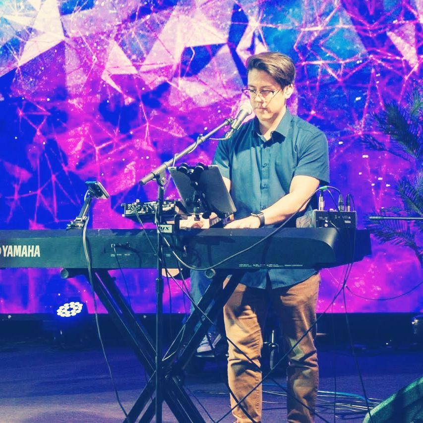 Sam playing piano on worship team at our church!
