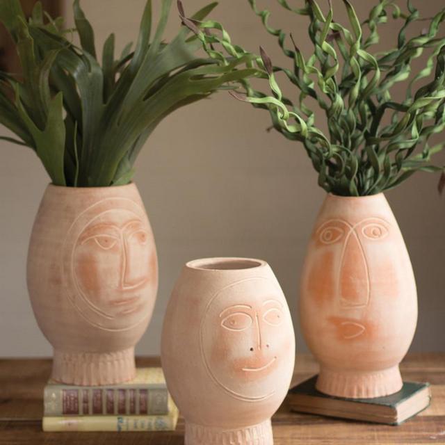 set of 3 clay face pots
