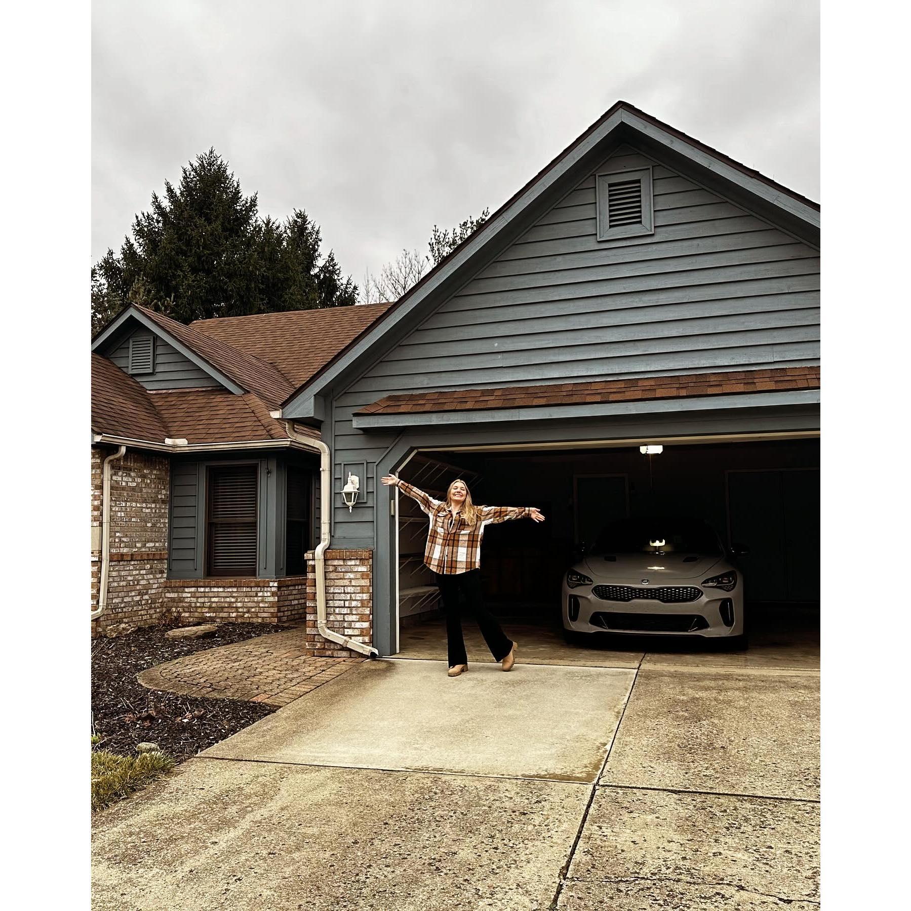 Kaylee in front of our house on closing day