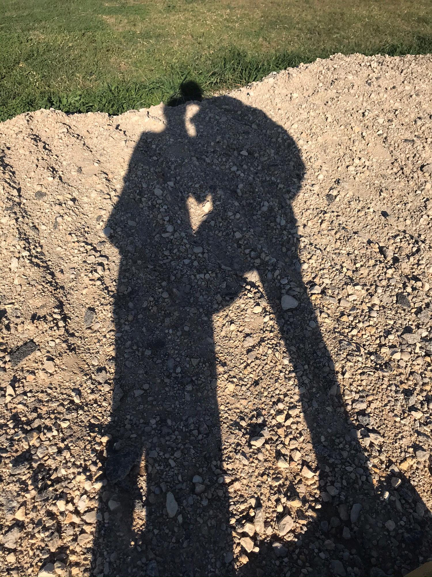 I wanted to take a picture of our shadows and later we noticed a perfect heart shape right in between us!